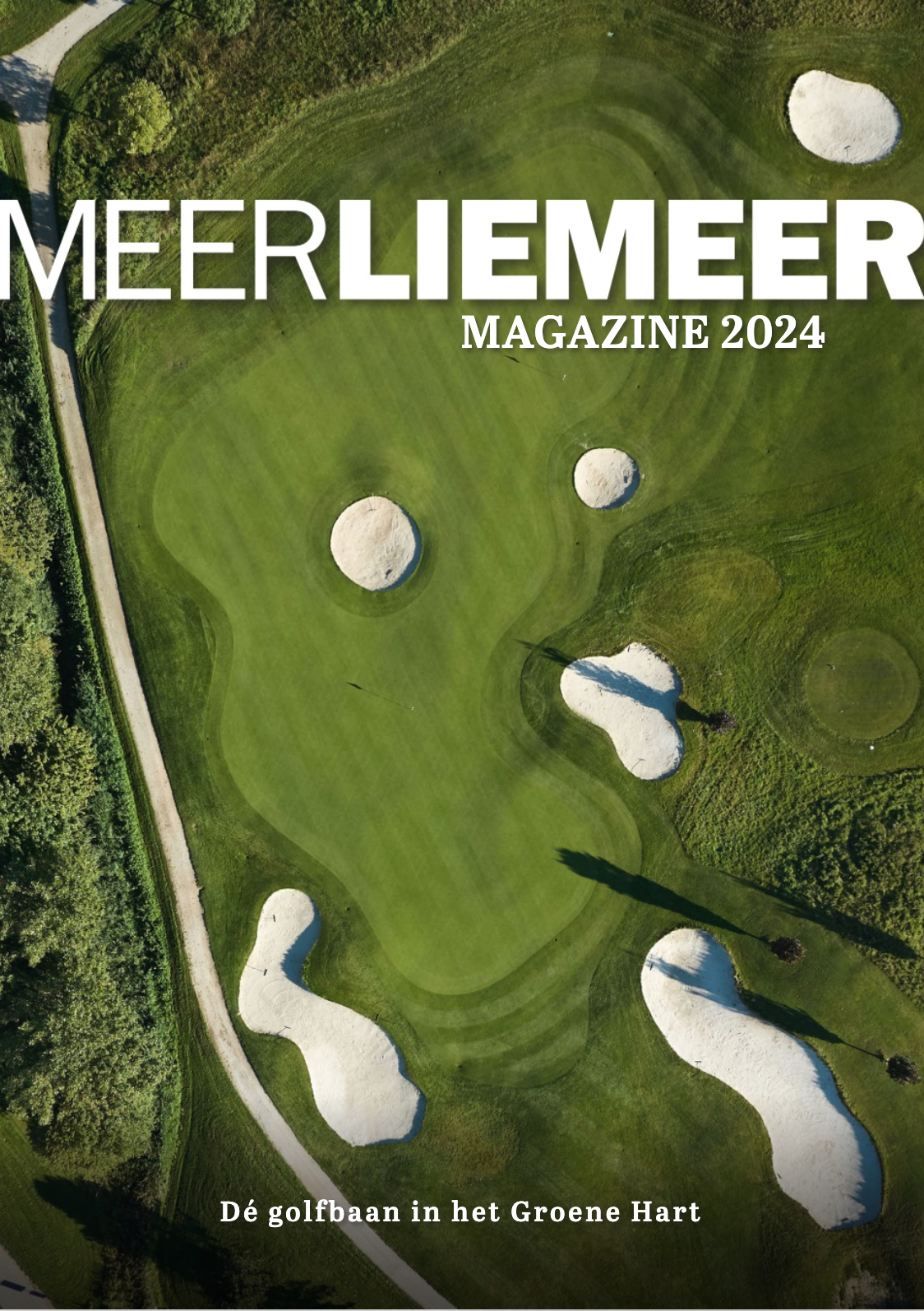 Aerial view of a golf course showing multiple holes with green fairways, white sand bunkers, and surrounding landscape.