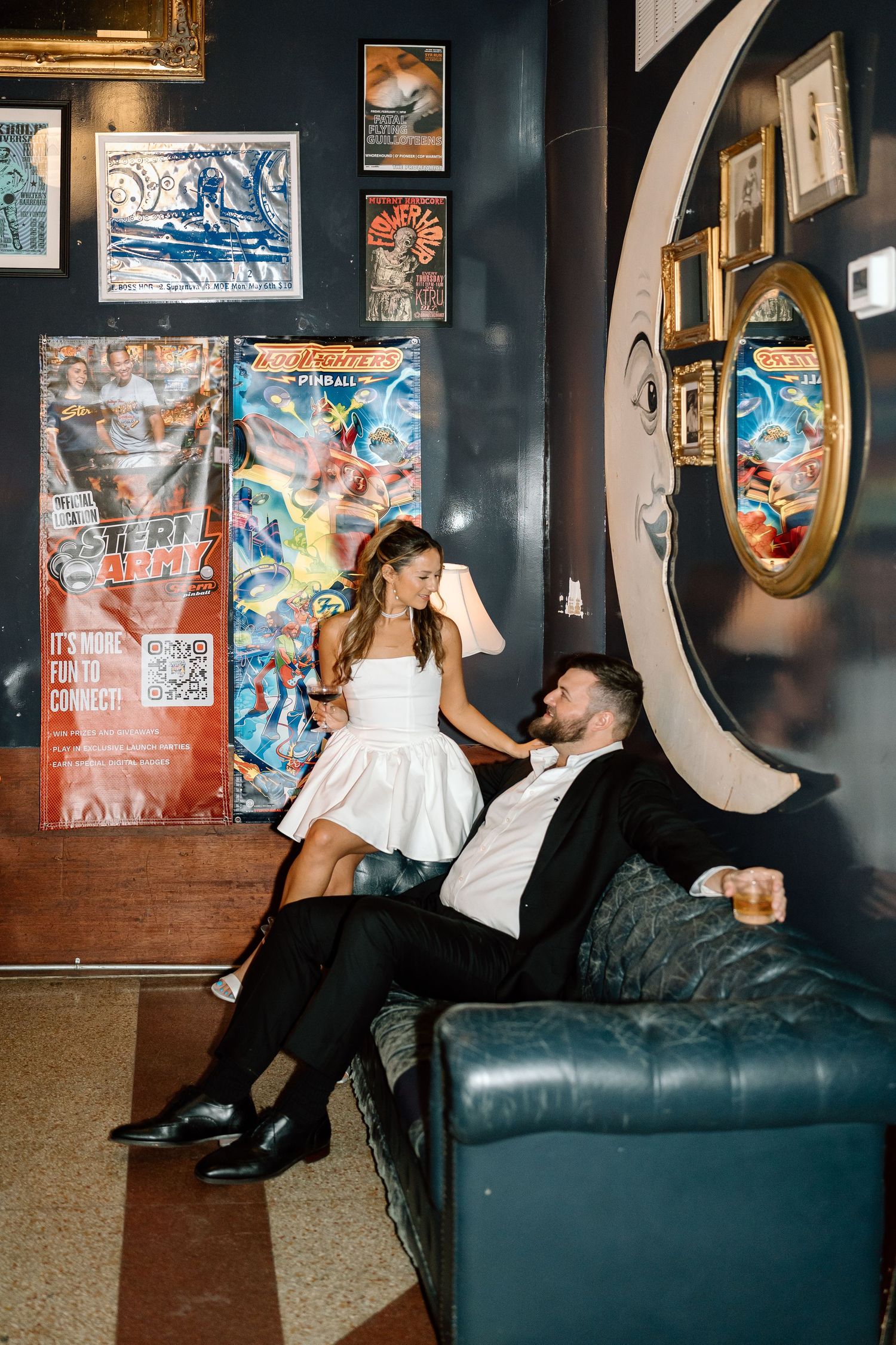 Stylish photo sequence of a couple in formal attire posing on a leather couch in an artistic setting.