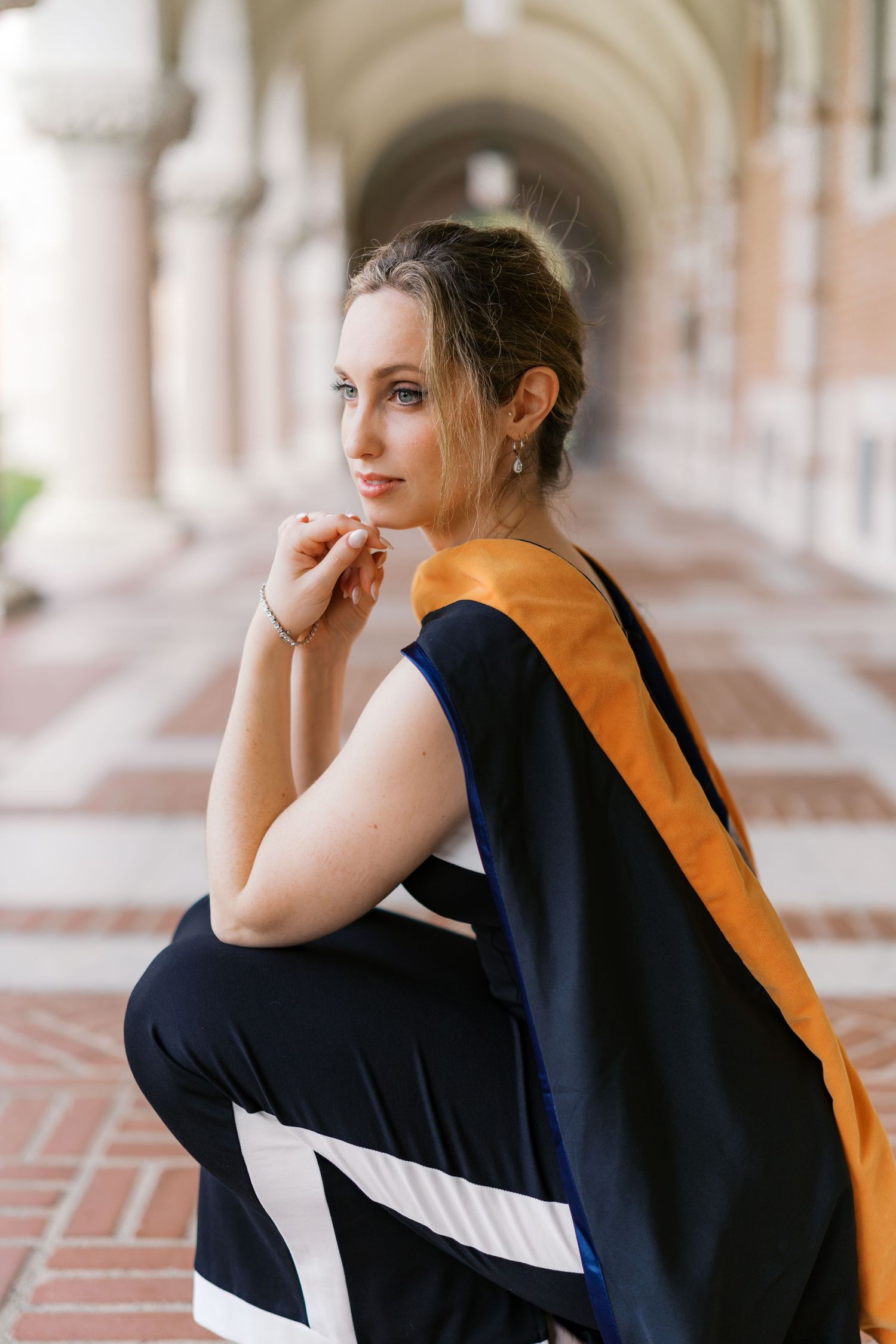 Artistic portrait series captured under classical arches with dramatic poses and lighting.