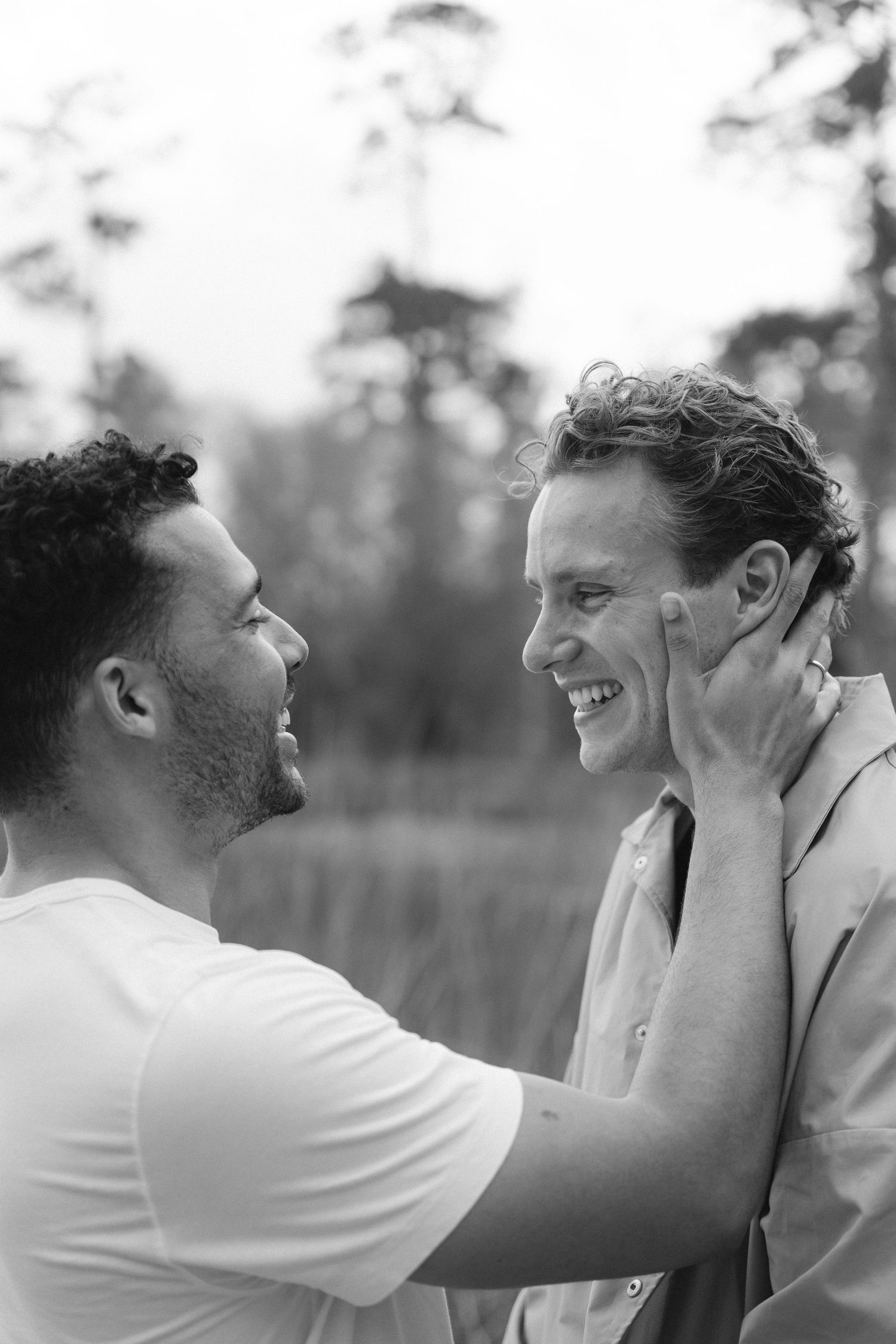 Black and white sequence of a romantic moment between a couple outdoors.
