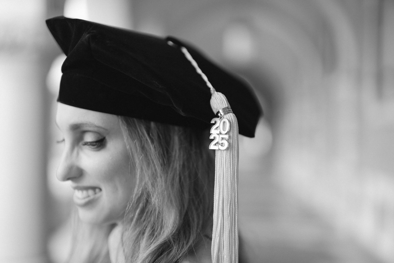 Black and white graduation portraits featuring academic cap with tassel.