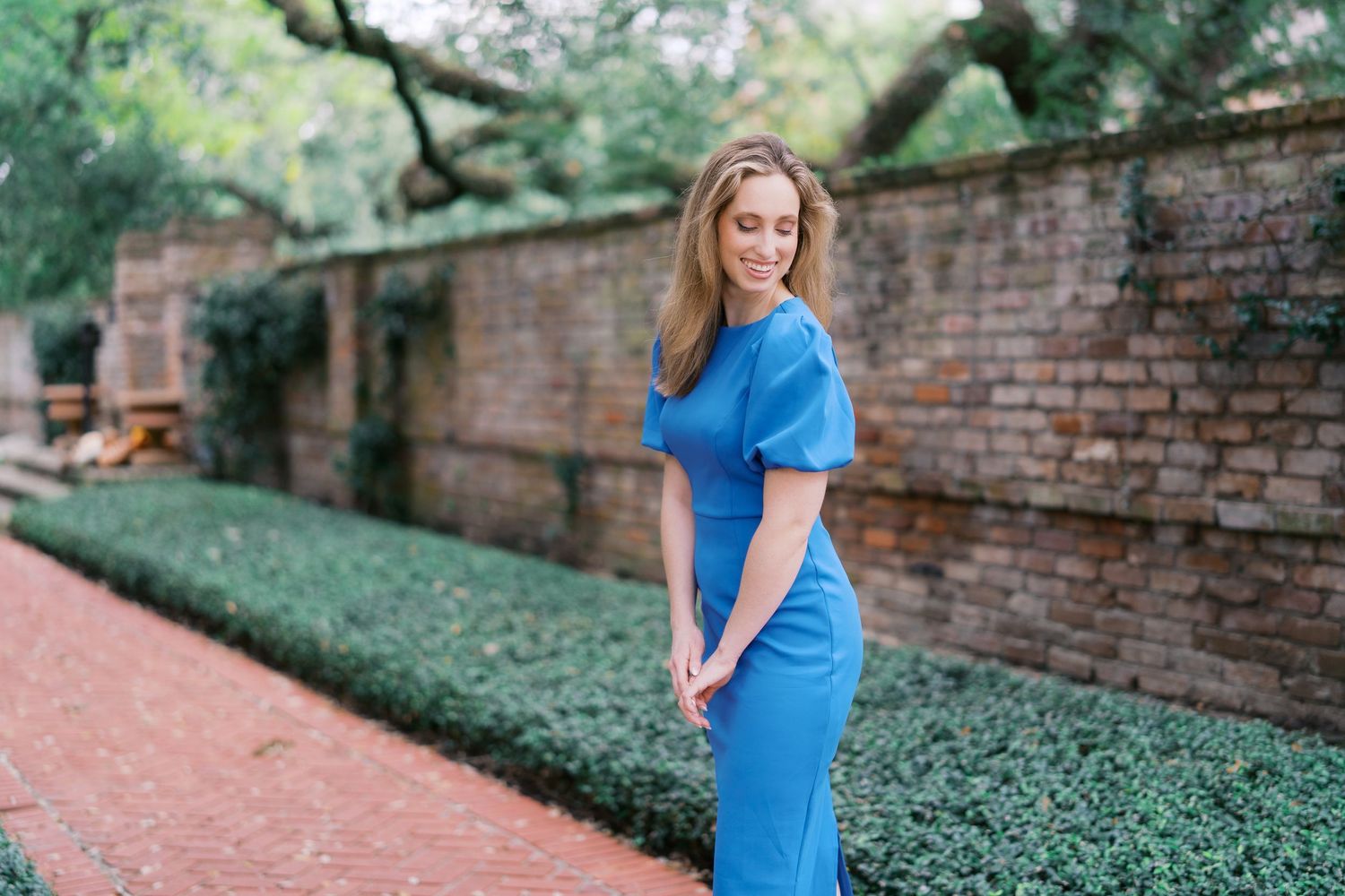 A series of candid moments captured along a tree-lined brick walkway.