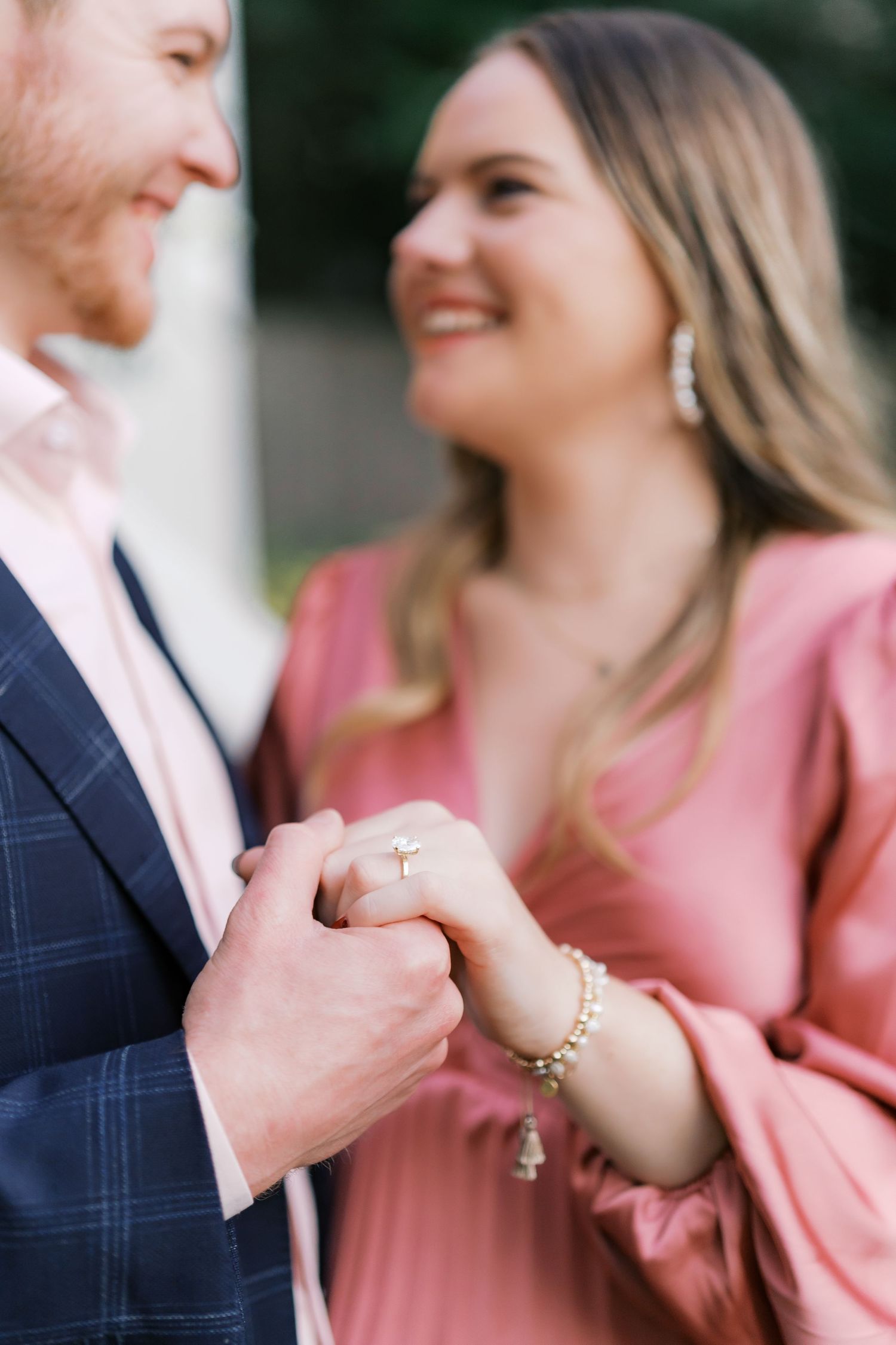 Close-up shots of engagement ring exchange during an emotional proposal moment.