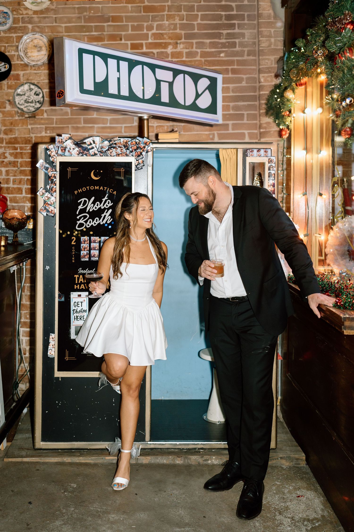 A series of candid moments captured outside a vintage photo booth at night.