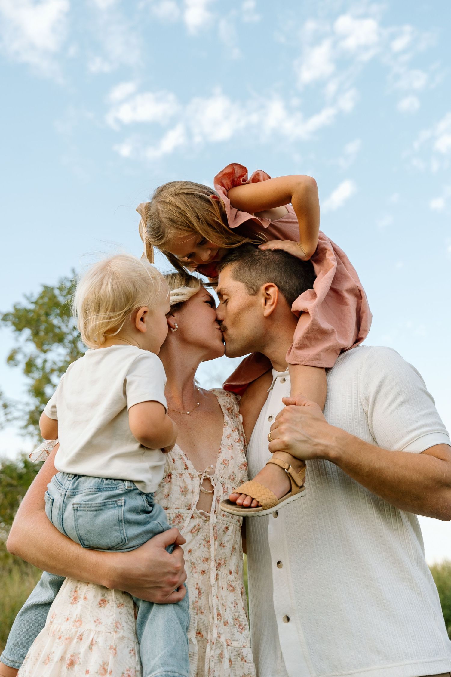 Sweet family moments captured in a series of outdoor portraits at golden hour.