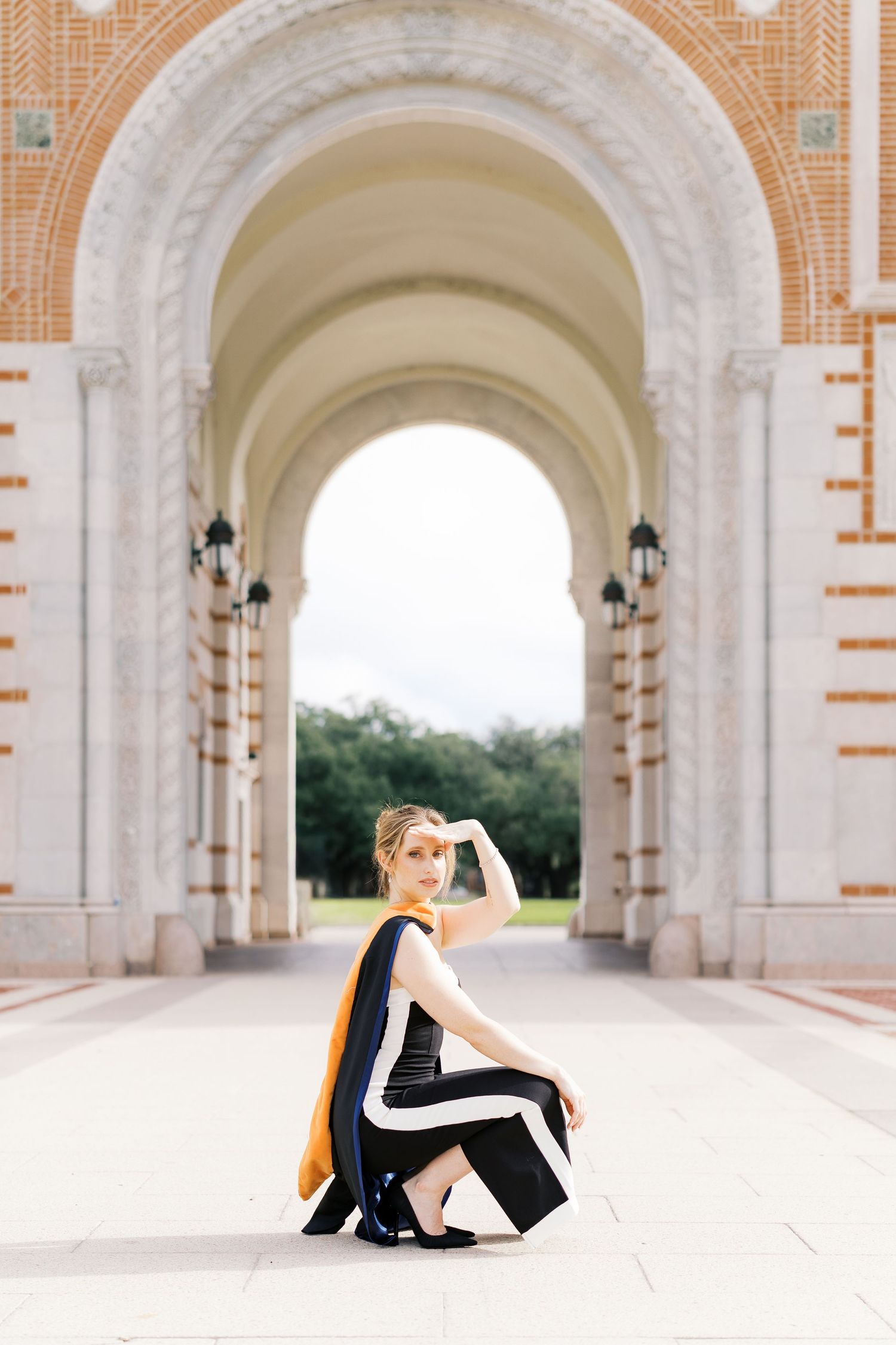 Architectural series showing a grand colonnade with repeating arches and orange brick details.