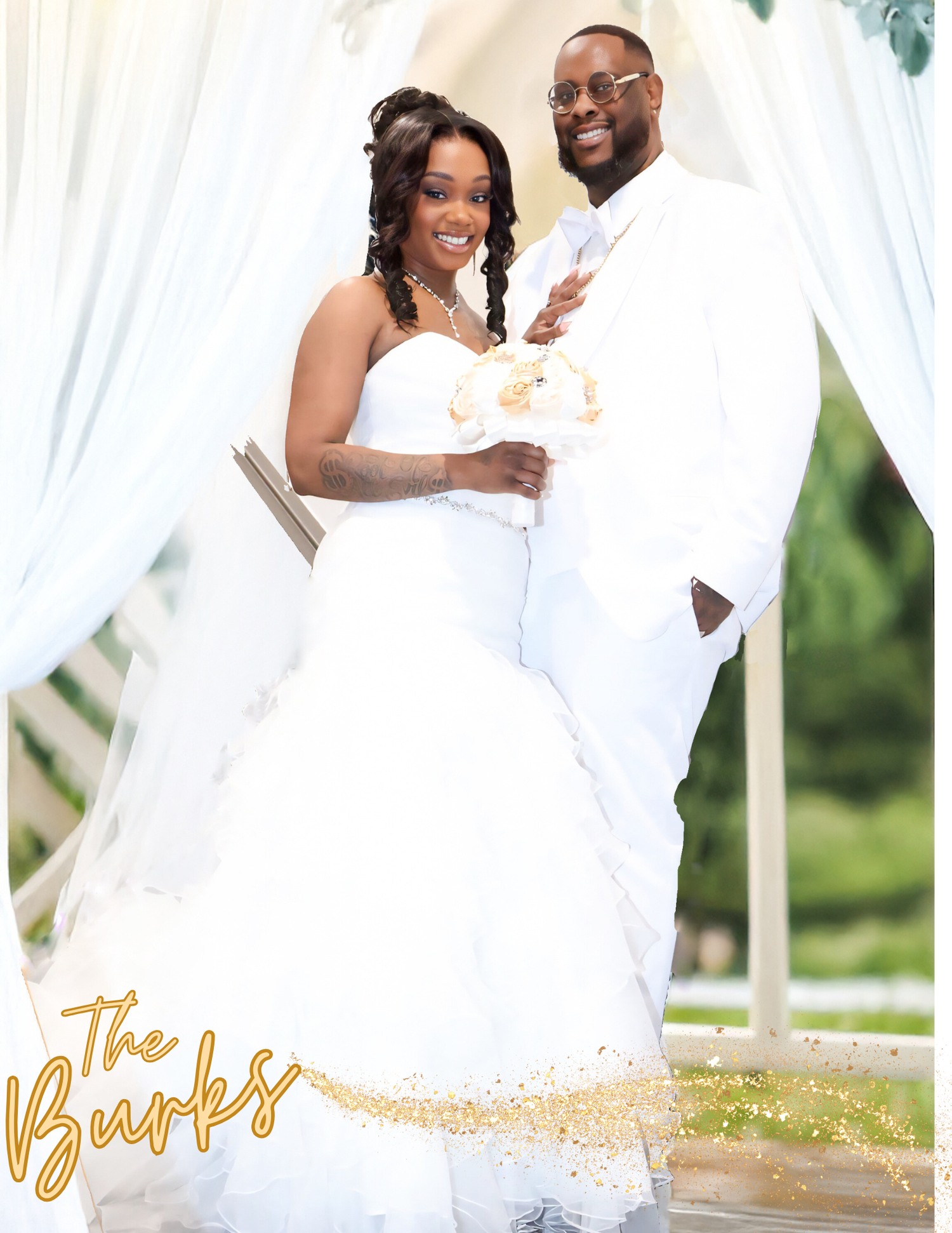 Bride and groom in matching white attire pose under floral arch at The Burks wedding ceremony.
