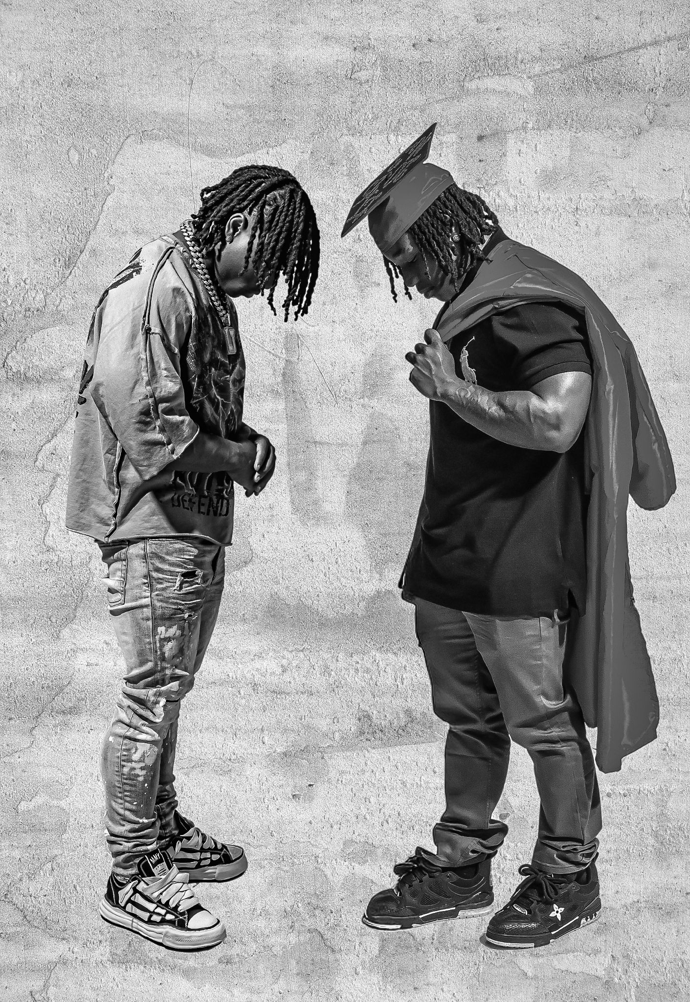 Two men with dreadlocks facing each other in black and white urban portrait photography.
