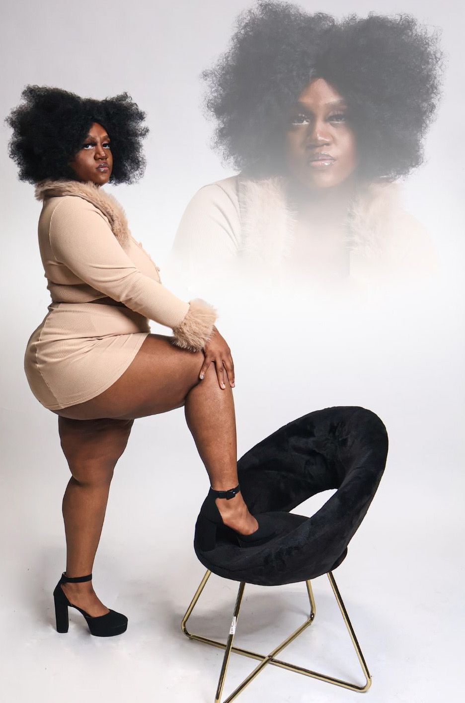 Plus-size woman in beige mini dress posing beside black velvet chair with double exposure effect.