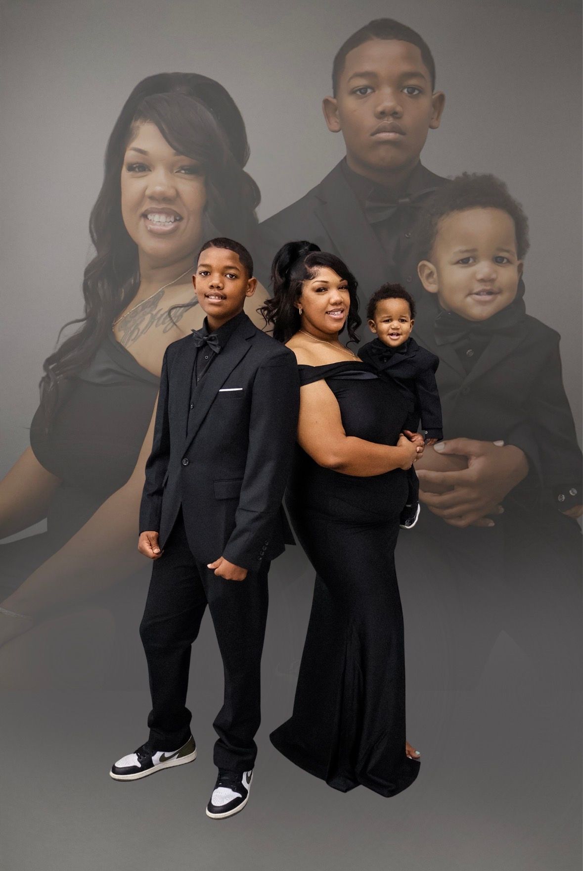 Woman in black gown poses with two sons in front of large family portrait composite image.