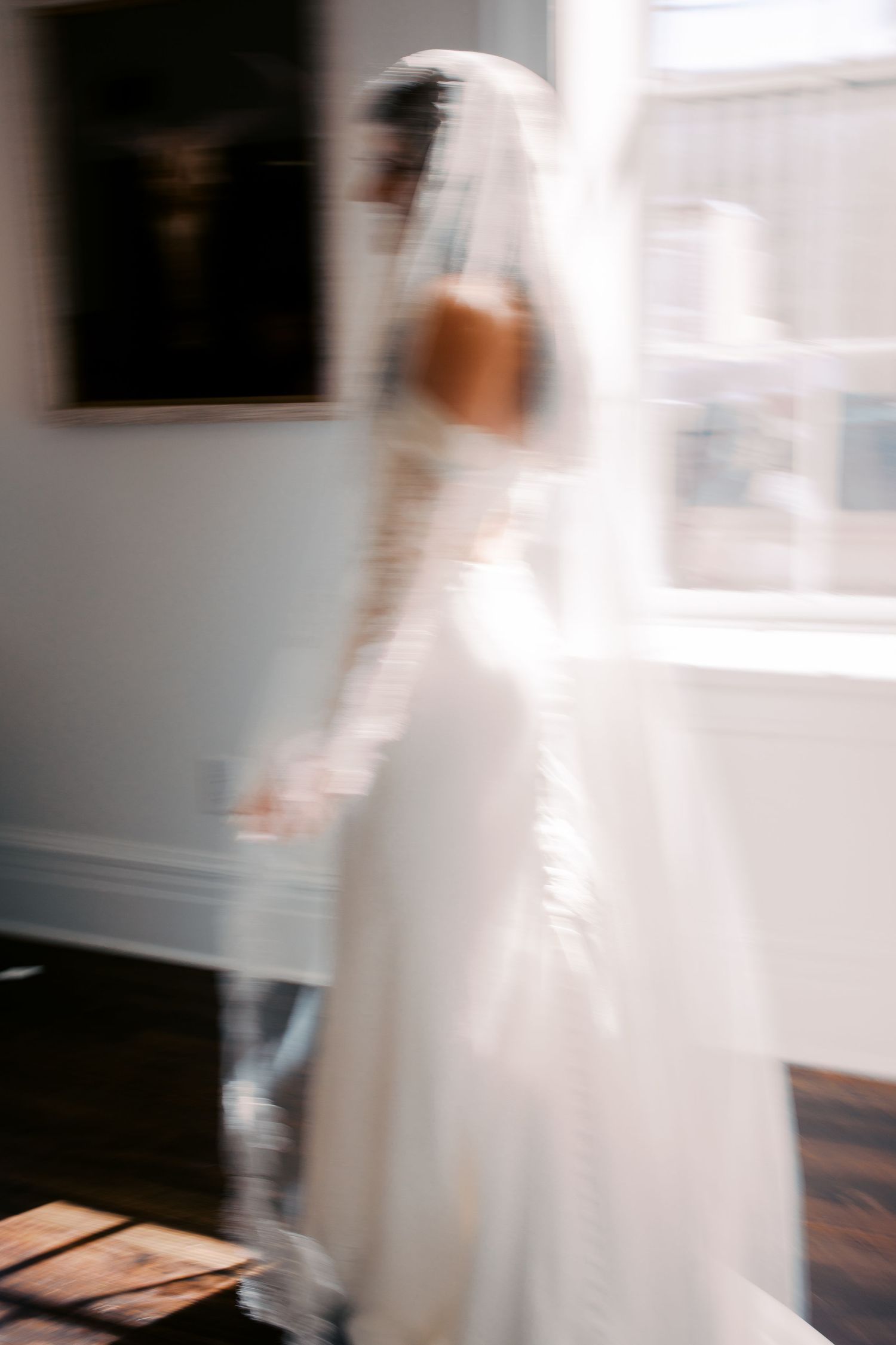 Abstract blurred motion sequence of a white wedding dress.