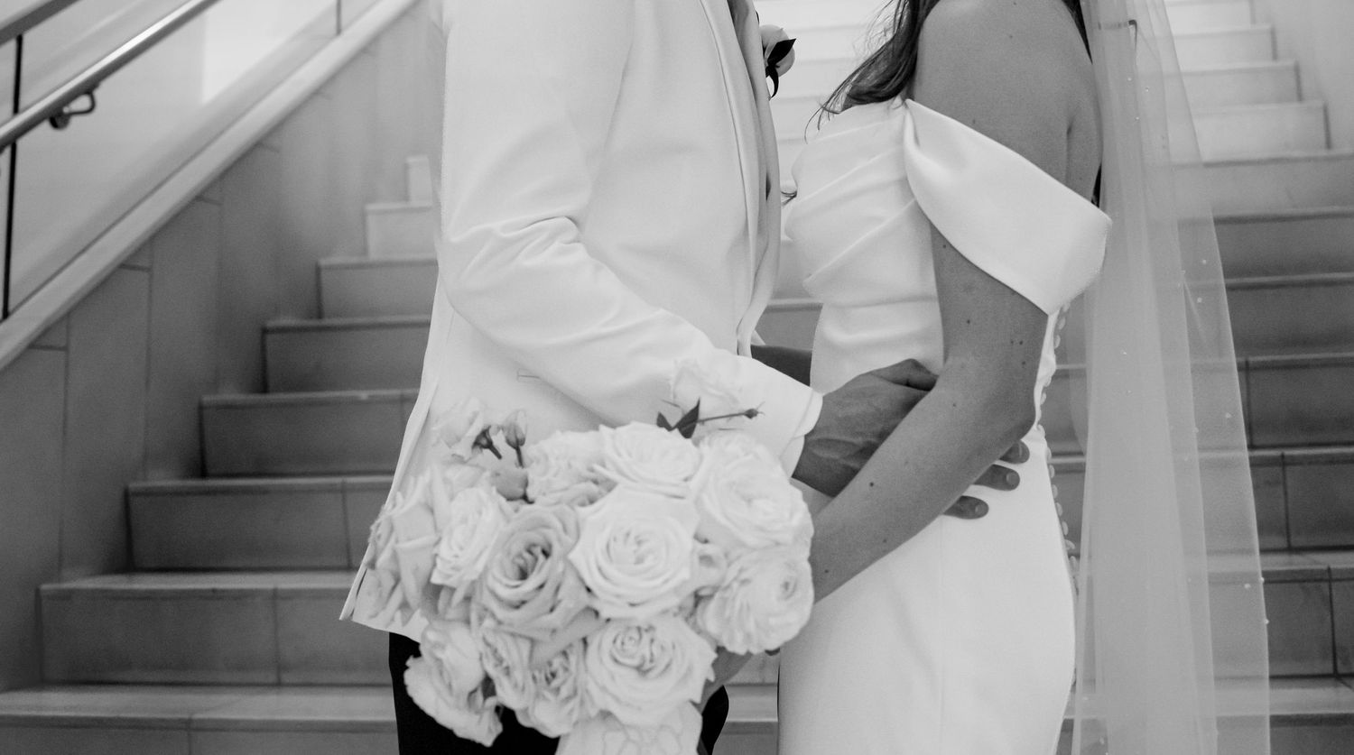 Black and white collage of wedding details showing hands holding bouquets and elegant dress details.