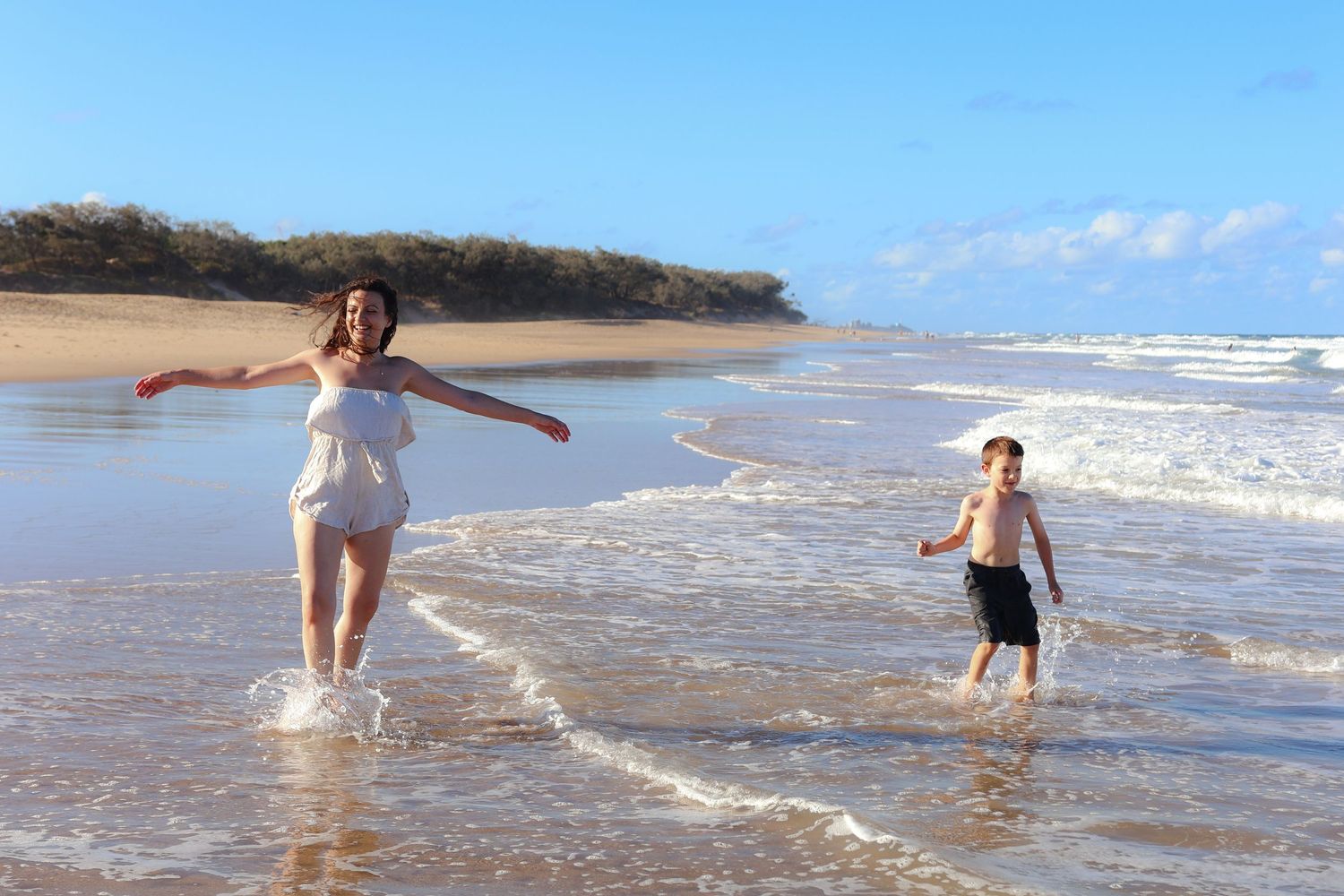 Mom and son spinning water currimundi beach sunshine coast family photographer