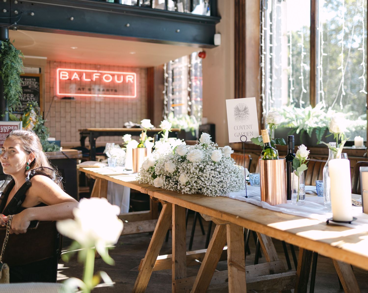 Modern restaurant interior with wooden tables and natural lighting creates warm ambiance.