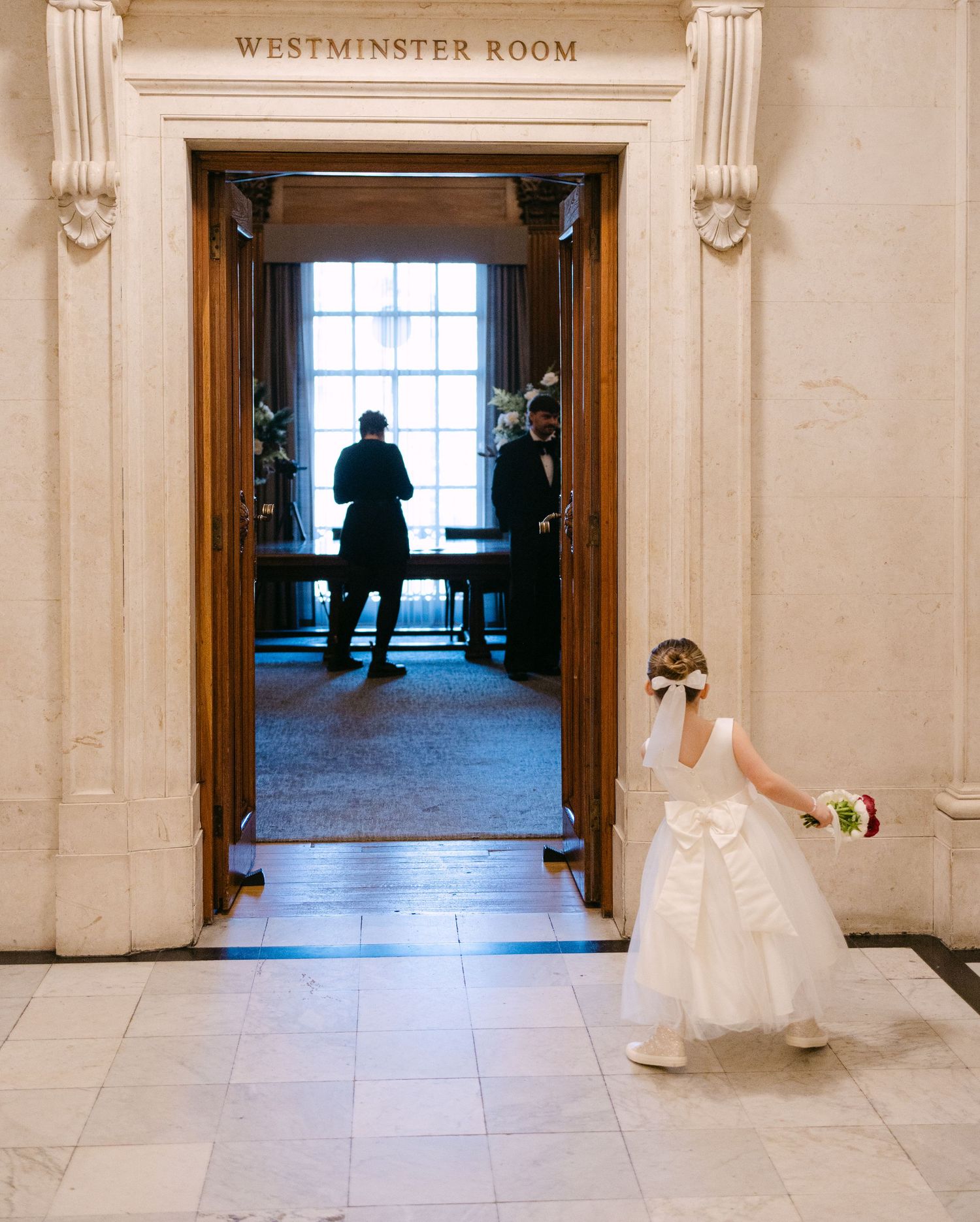 Westminster Room entrance with classic architectural details and marble floors.