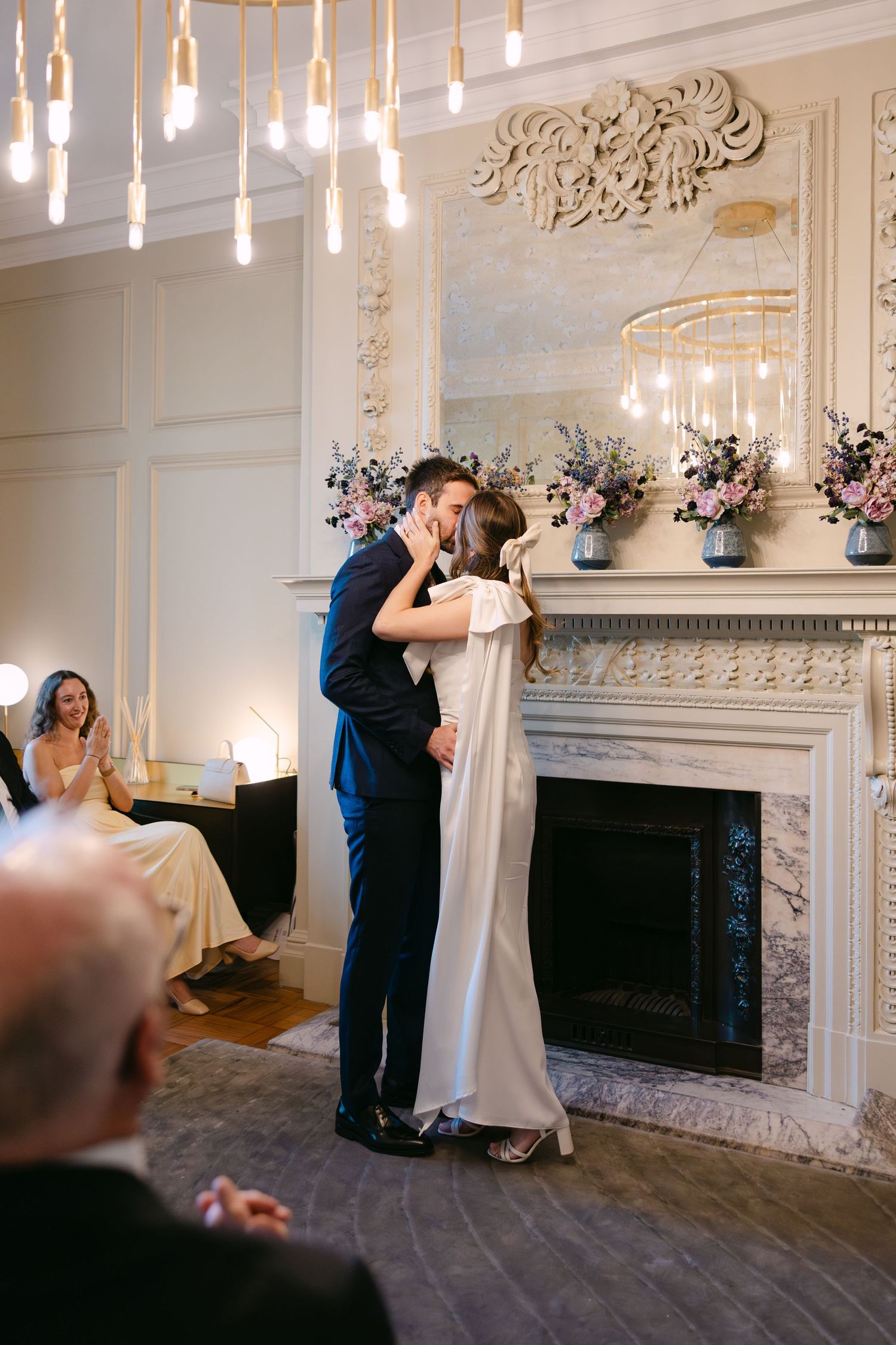 First kiss in ceremony room at Old Marylebone Town Hall London wedding