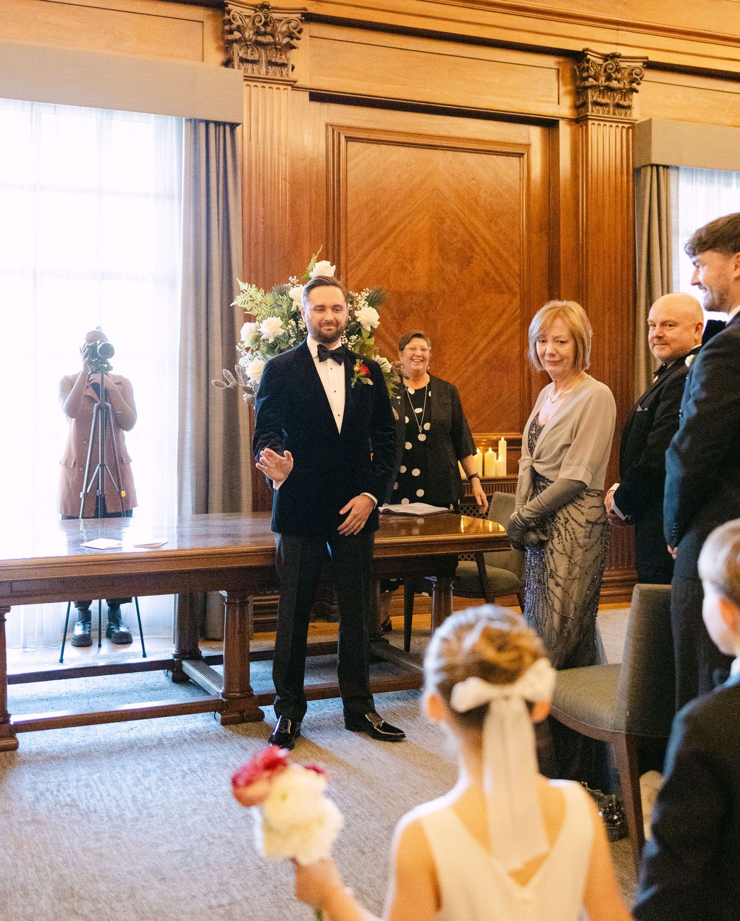 Elegant wood-paneled Westminster Room during a formal wedding gathering.