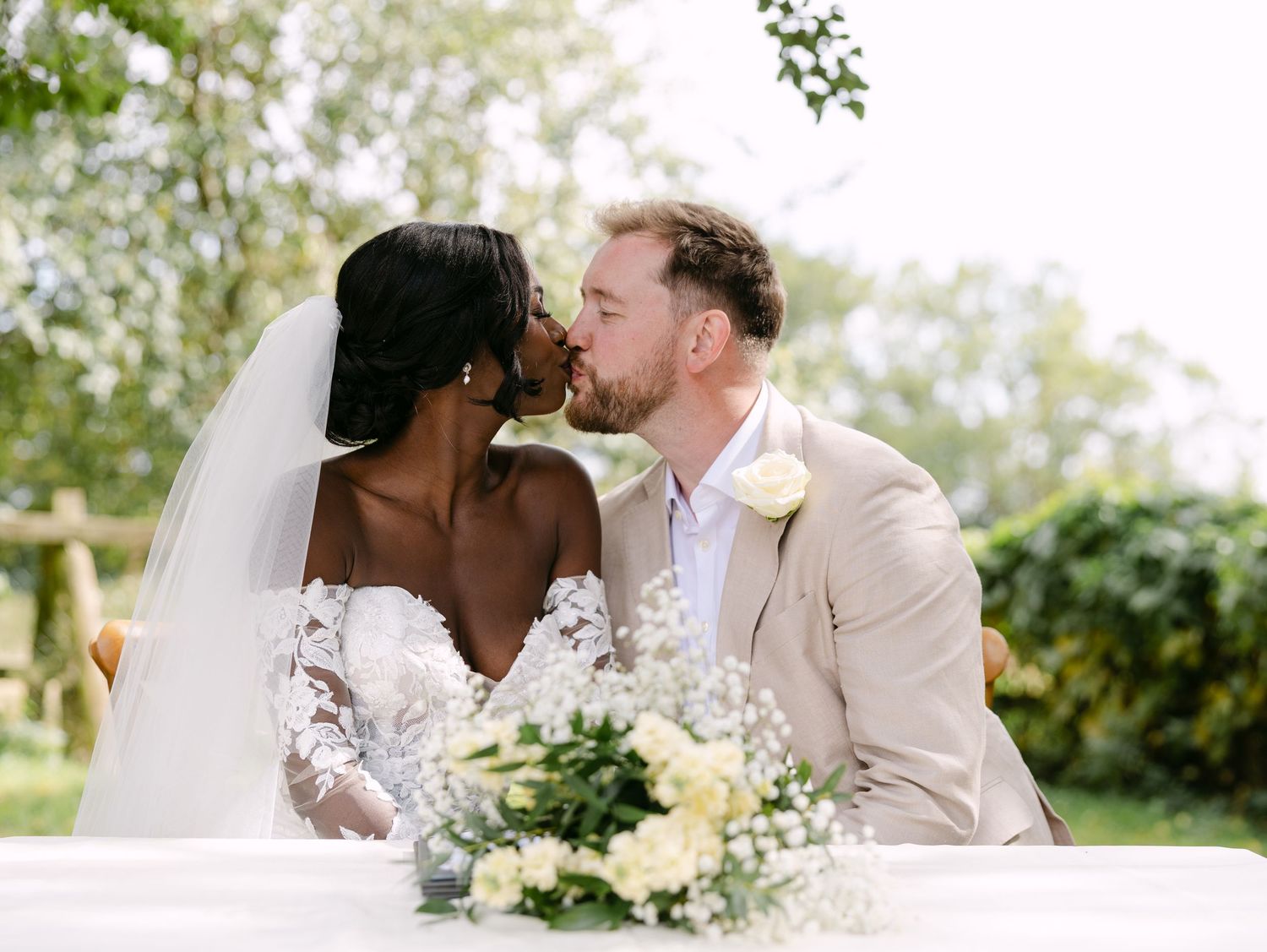 Intimate wedding ceremony moments captured in a lush garden setting.