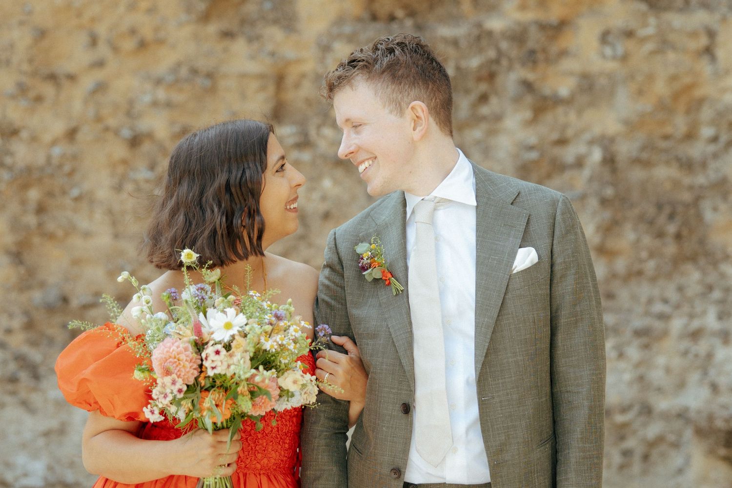 Couple sharing a kiss during their wedding portraits at Reading Abbey Ruins