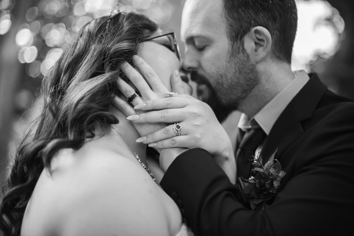 A black and white wedding photography collage showing intimate moments between the newlyweds.