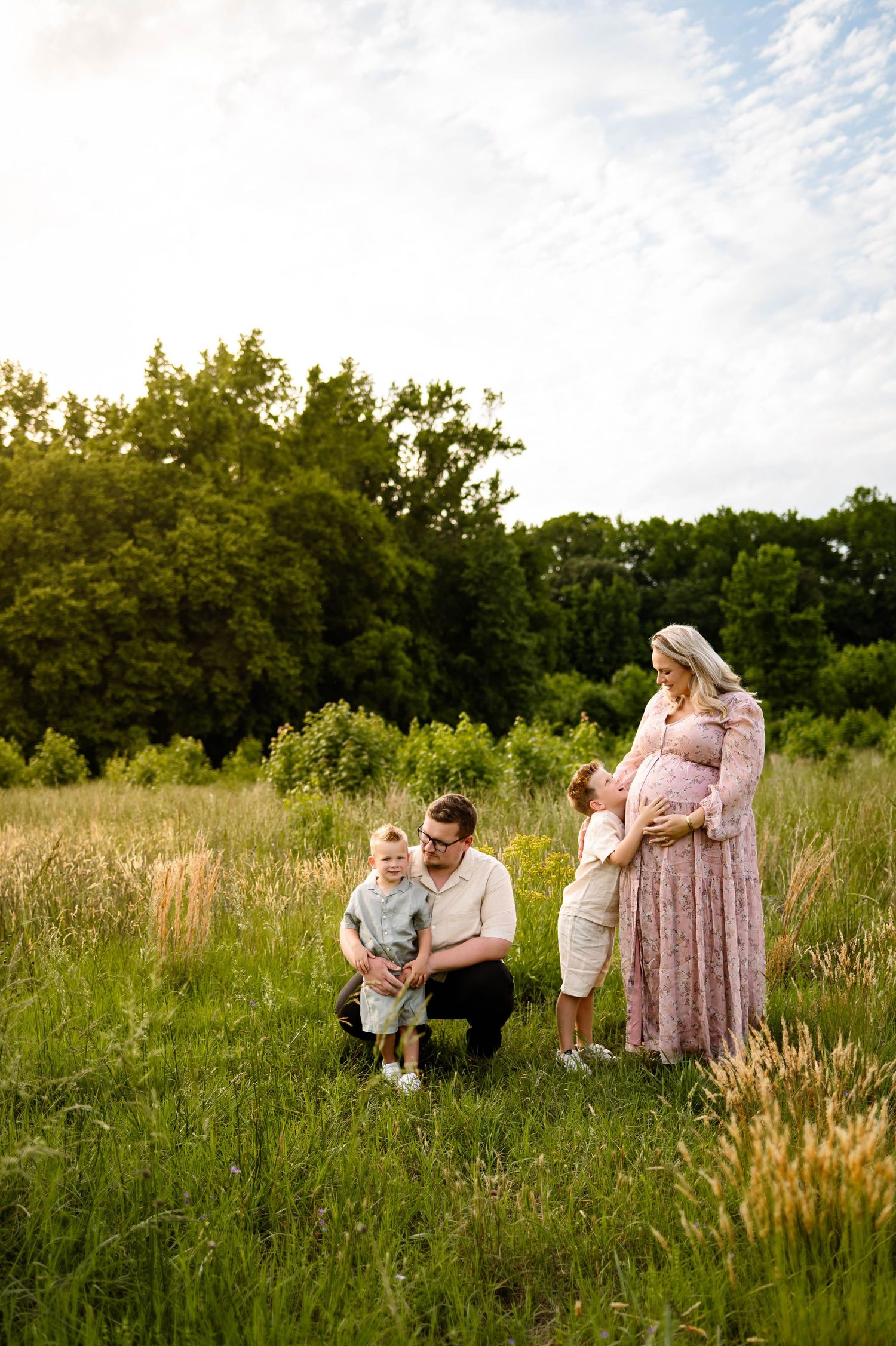 Family of four during a maternity photography session in Raleigh NC with Emma Branch Photographer