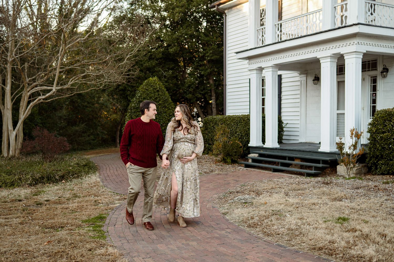 Expecting couple walking together during an outdoor maternity photography session in Raleigh North Carolina