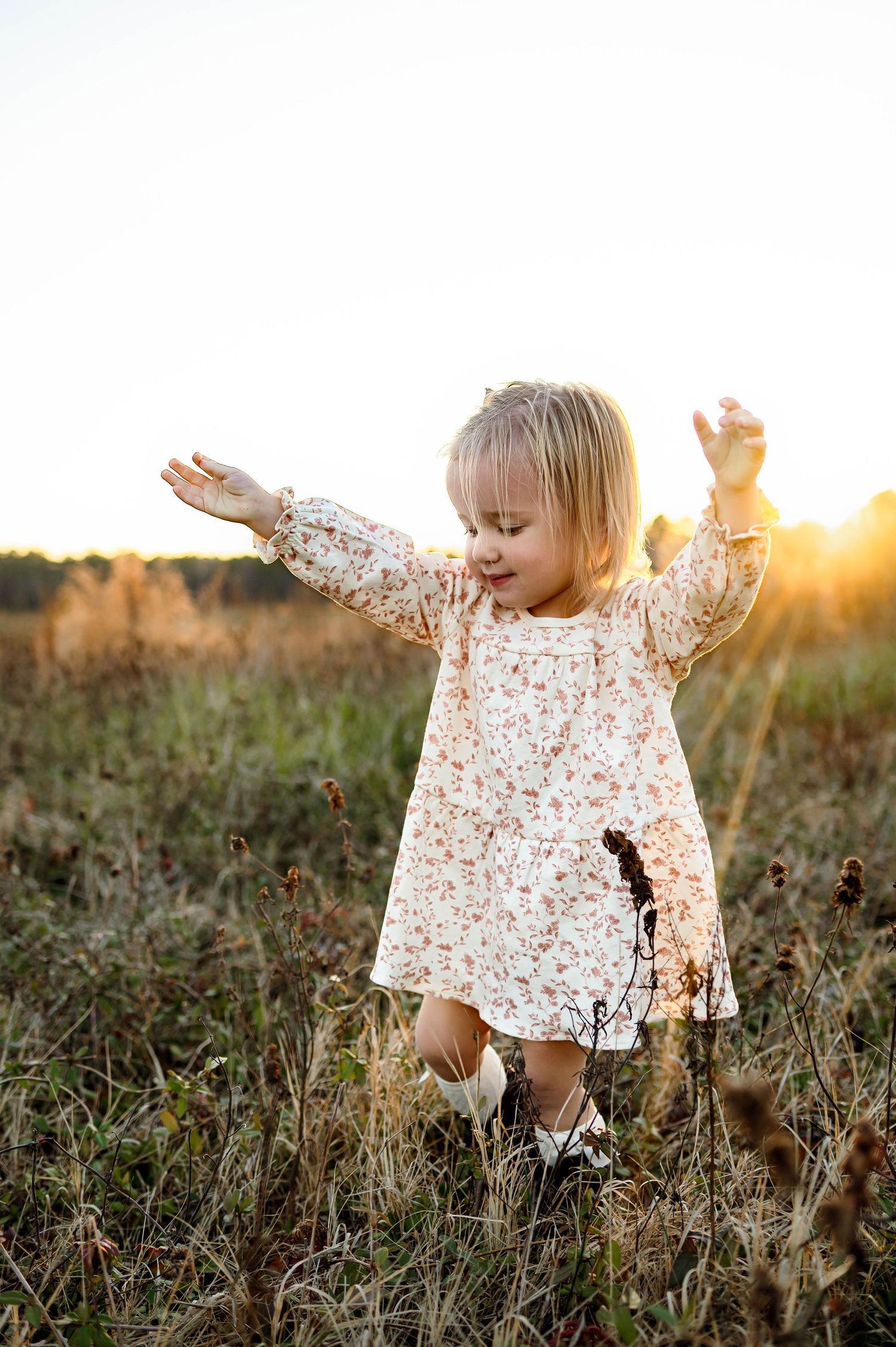 Toddler exploring outdoors during a winter family photography session in Raleigh NC