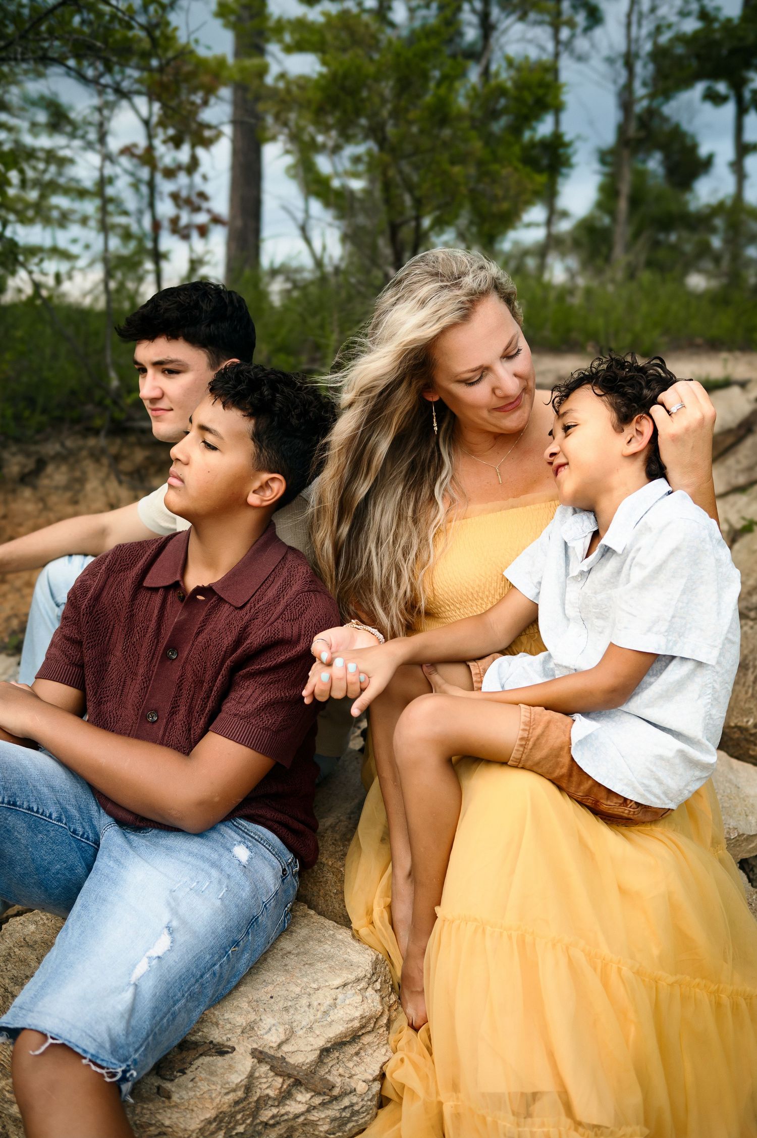 Mother with her sons during a relaxed outdoor lifestyle family photography session in Raleigh, NC