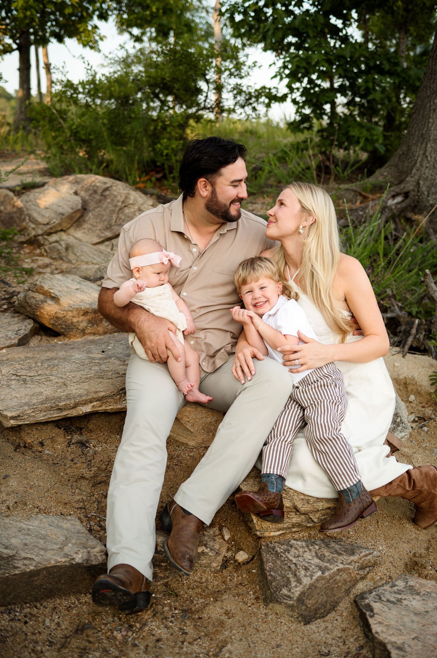 Family of four with two young children during an outdoor family photography session in Raleigh, NC