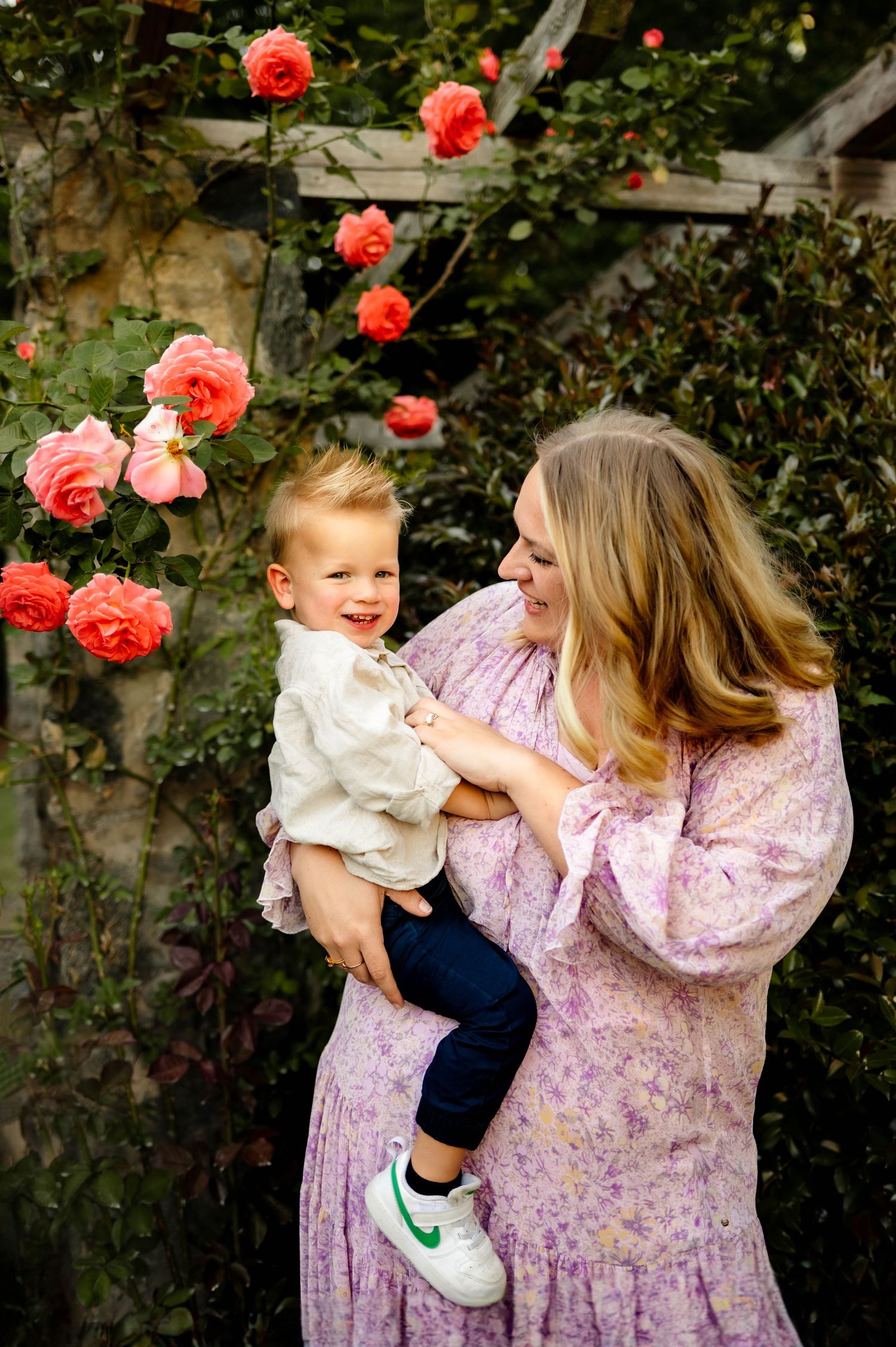 Mother holding her young son during a spring family photography session in Raleigh with Emma Branch