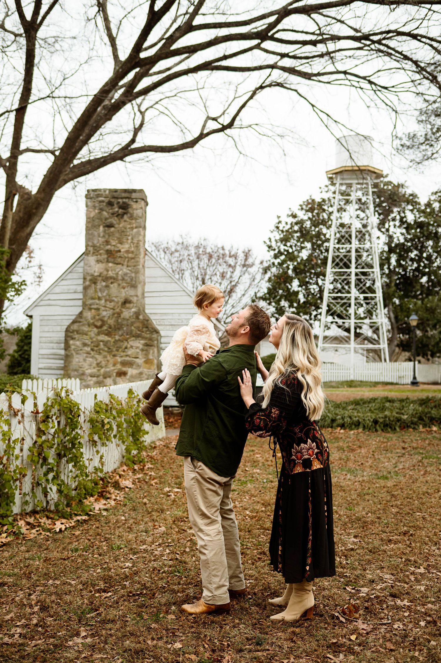 Family with toddler during an outdoor family photography session at Historic Oak View County Park in Raleigh NC
