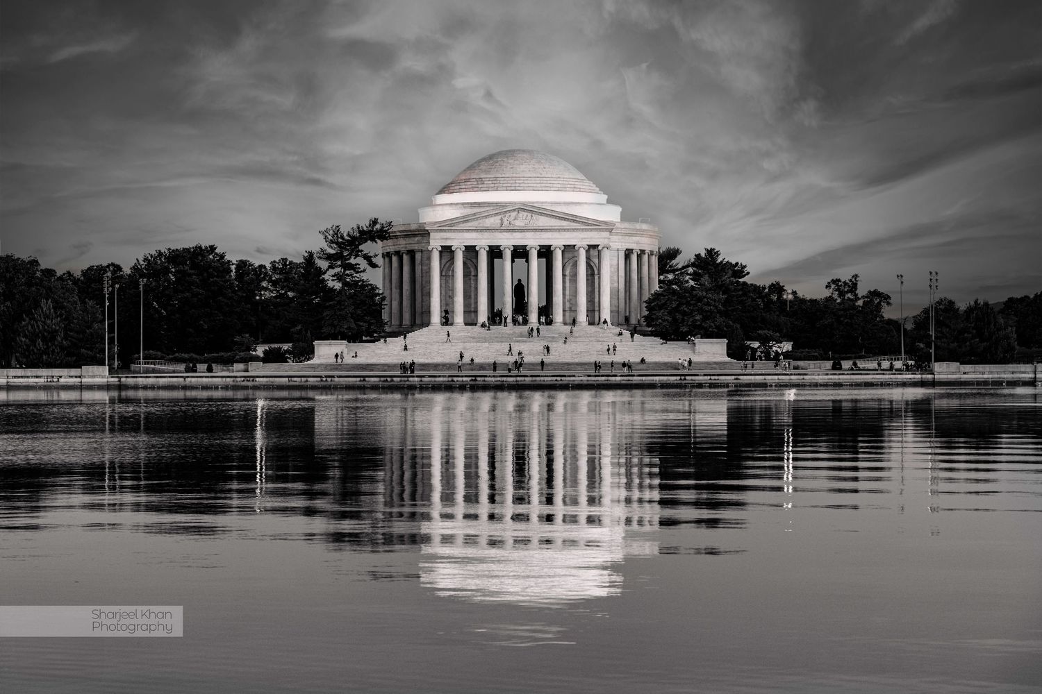 Black and white photograph of the Jefferson Memorial reflecting in the Tidal Basin in Washington DC.