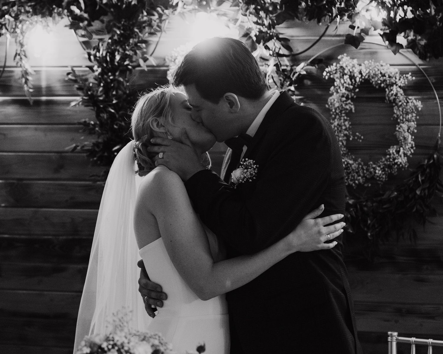 Black and white wedding photography series showing romantic first dance moments at a reception.