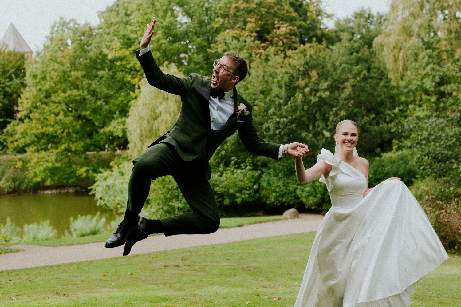 A sequence of four photos showing a playful martial arts kick move performed outdoors in a park setting.
