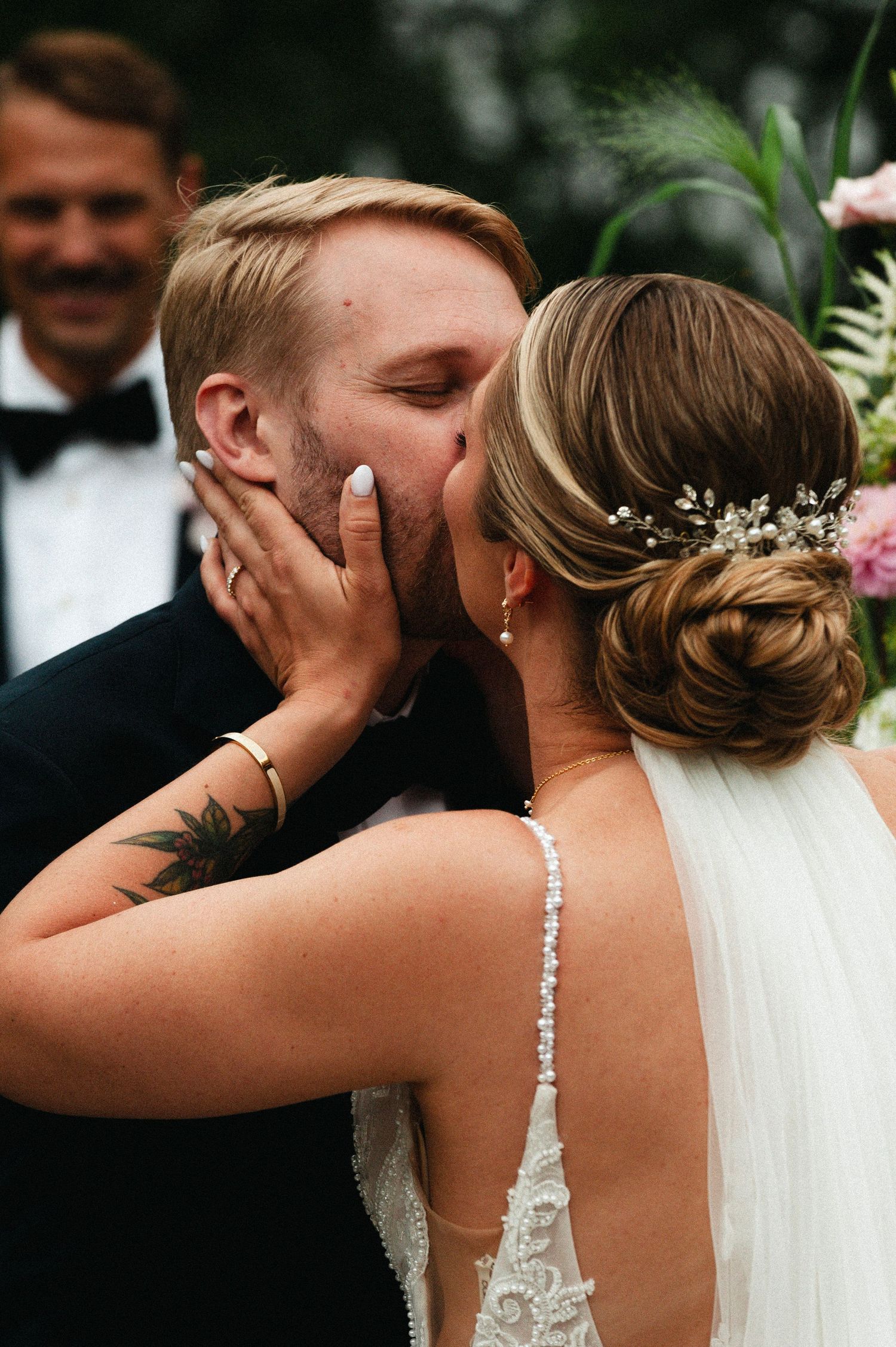 Romantic wedding photo sequence capturing intimate moments between newlyweds during their outdoor celebration.