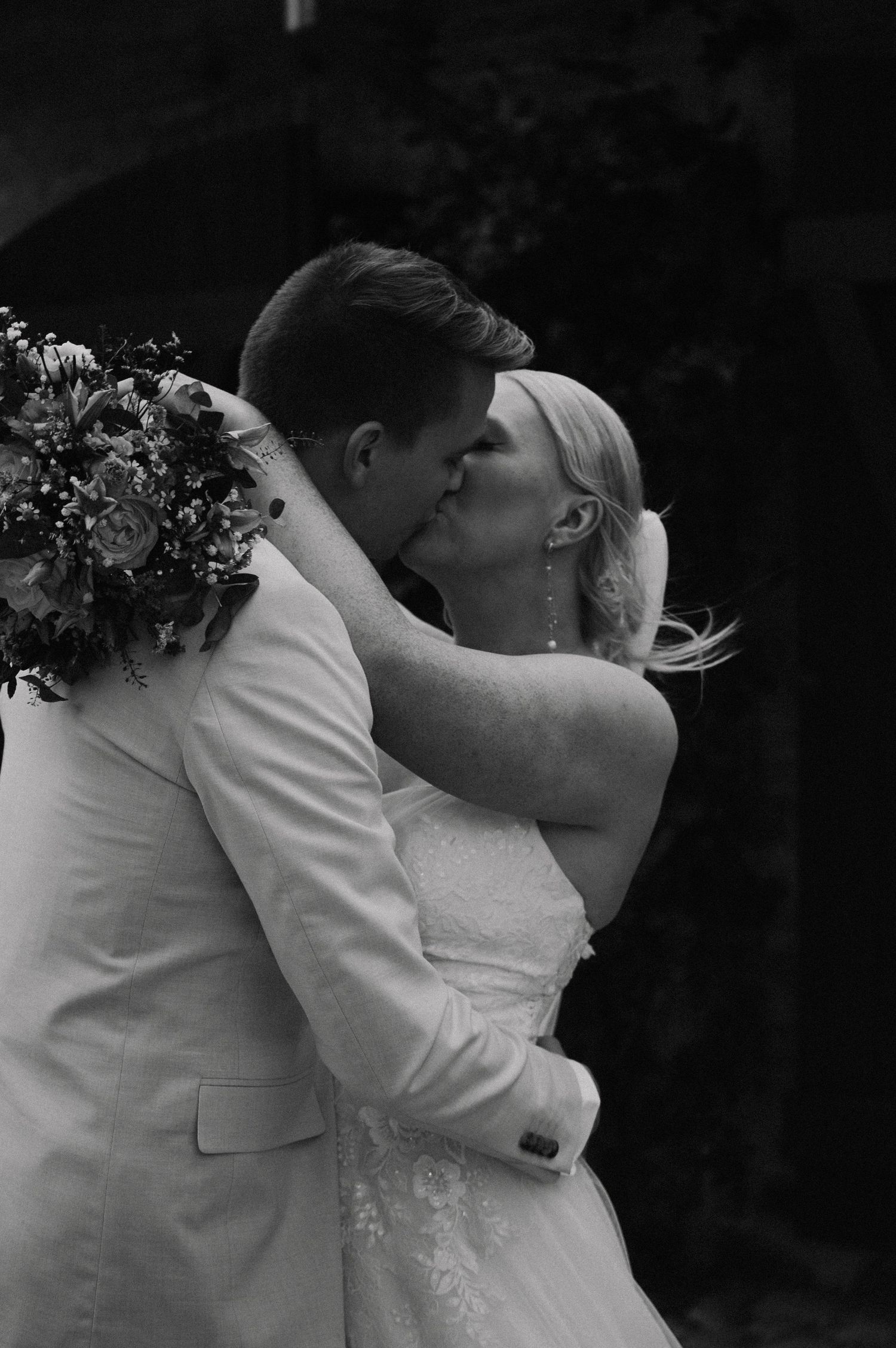 A romantic black and white wedding photo during a couple's first dance.
