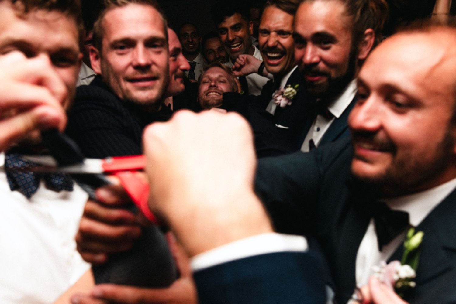 Candid reactions of wedding guests during a reception celebration.