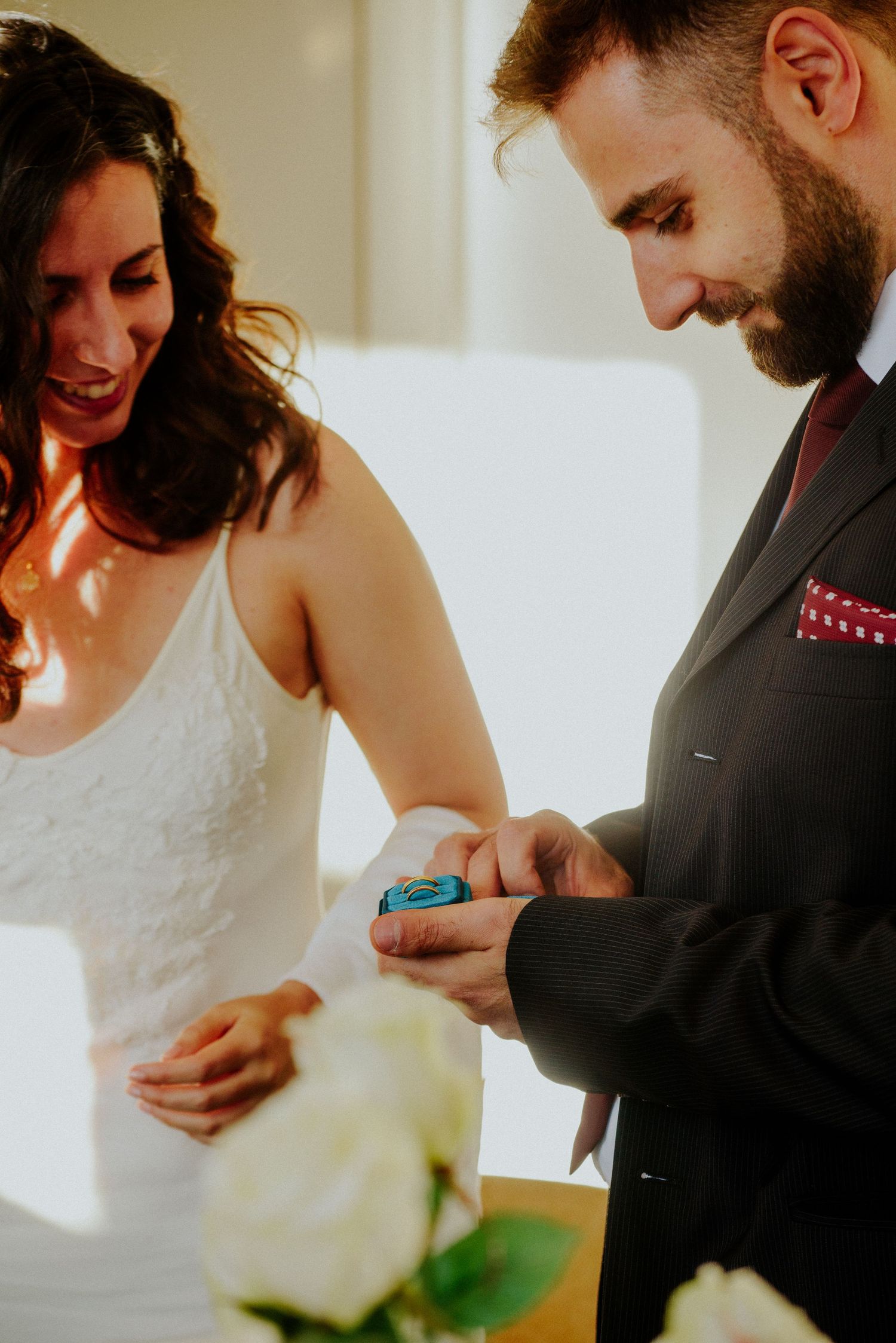 A series of intimate moments between a bride in white and groom in dark suit during their wedding celebration.