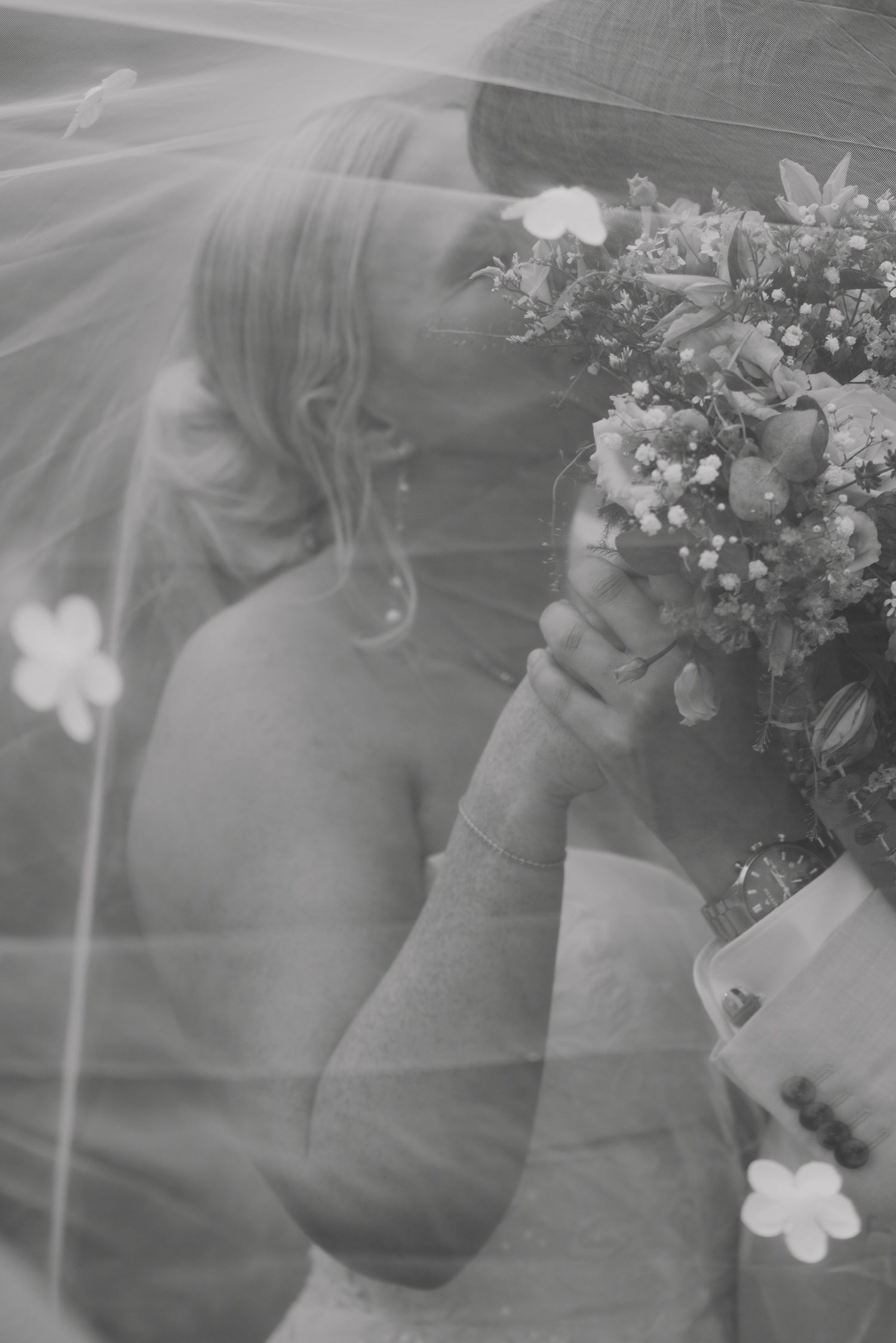 Dreamy wedding photos with soft focus and floral elements.