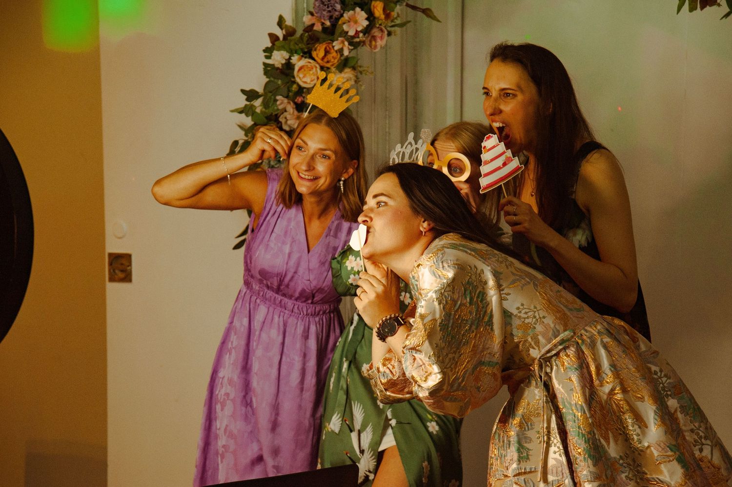 Wedding guests singing karaoke together at a vibrant party celebration.