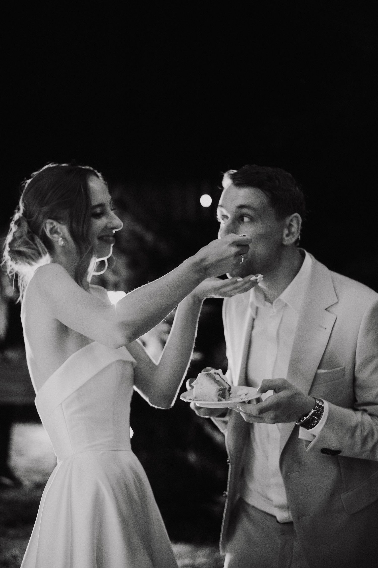 A sequence of black and white photos showing a couple dancing and twirling together at a wedding reception.