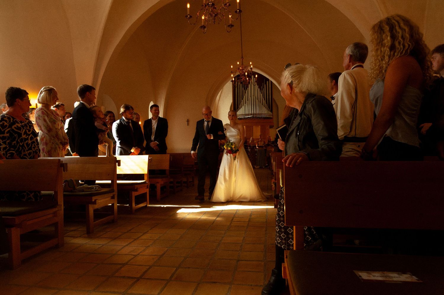 Elegant wedding reception venue with warm lighting and classic decor creates an intimate atmosphere.