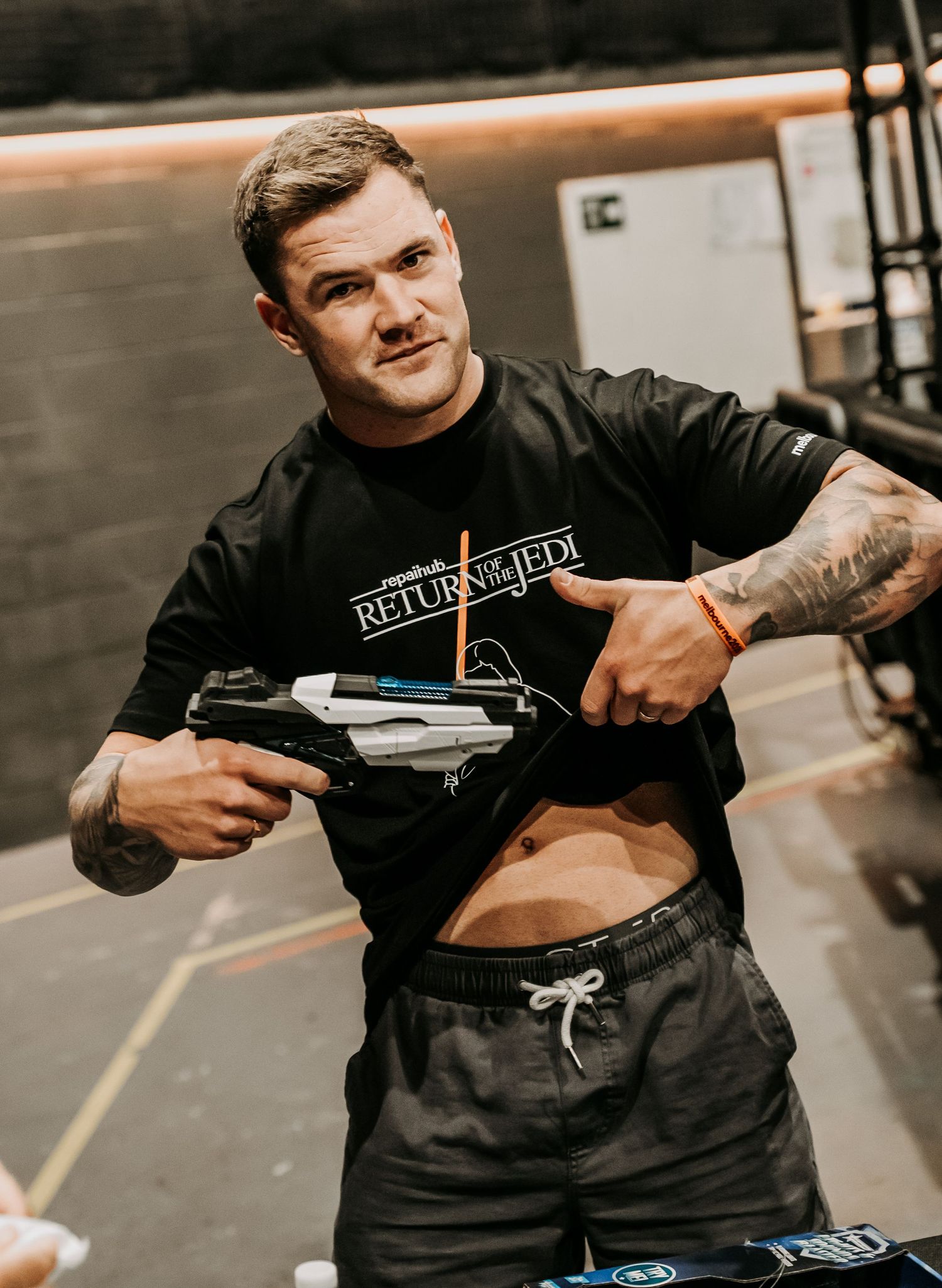 Person in black clothing demonstrating self-defense techniques with a training weapon in a series of action shots.