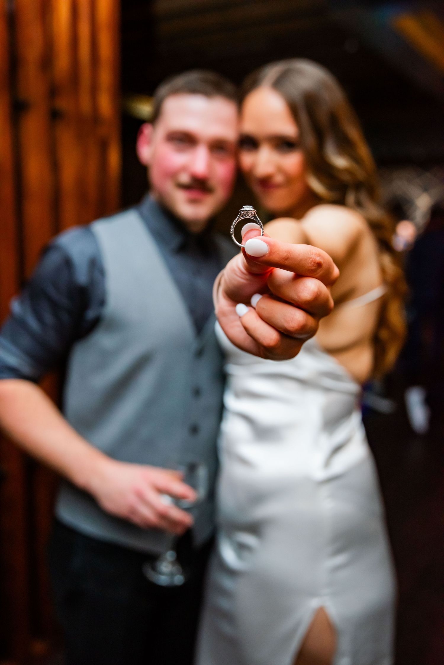 A romantic wedding dance sequence showing a couple in formal attire sharing intimate moments on the dance floor.