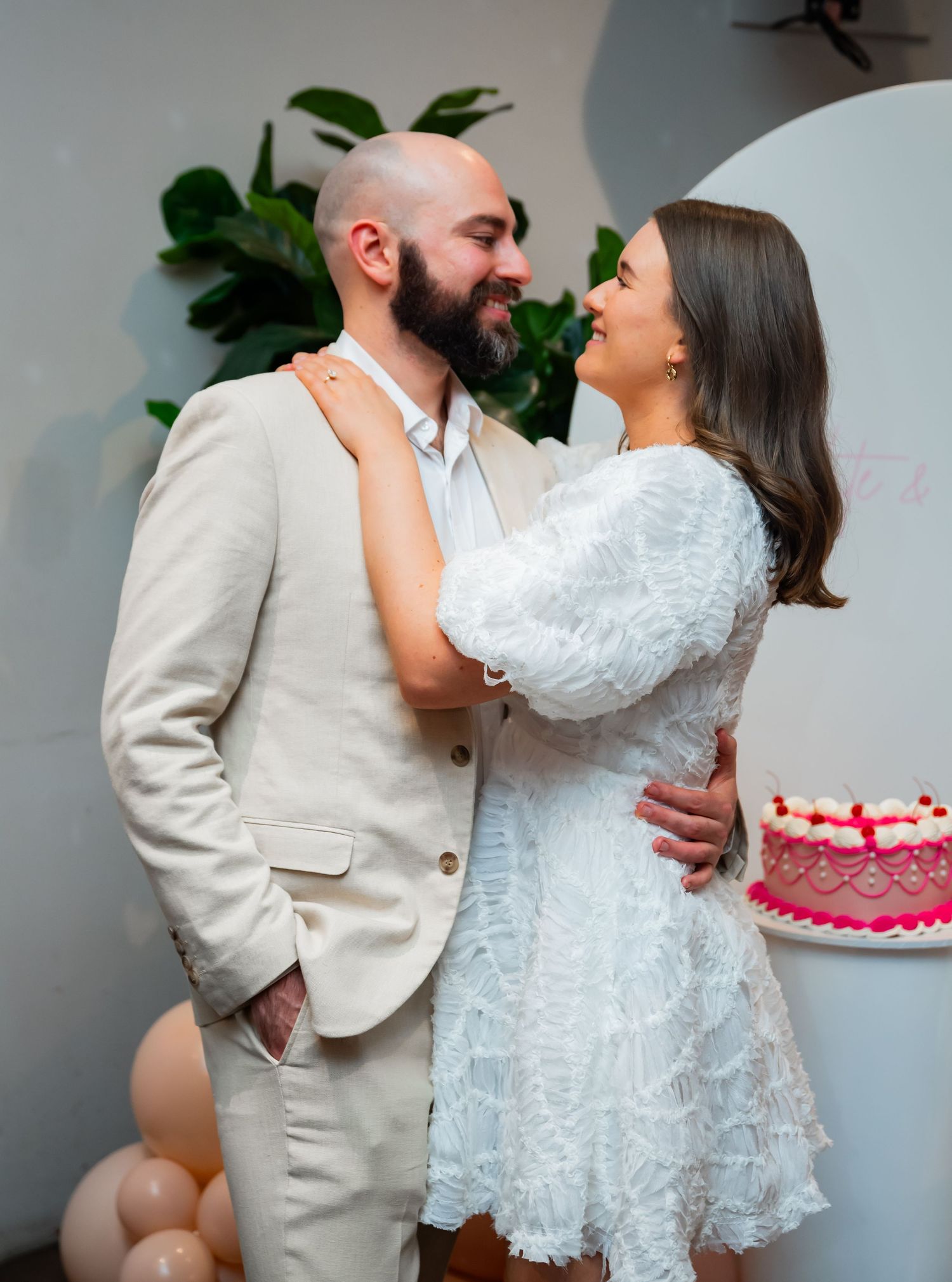 A romantic sequence of wedding cake cutting photos shows a couple in white attire sharing sweet moments together.