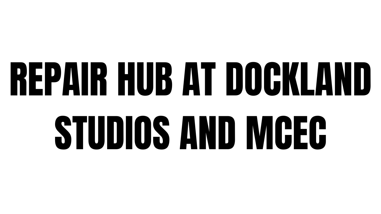 A large construction site with cranes and scaffolding at Dockland, featuring repair hub facilities and studio spaces.