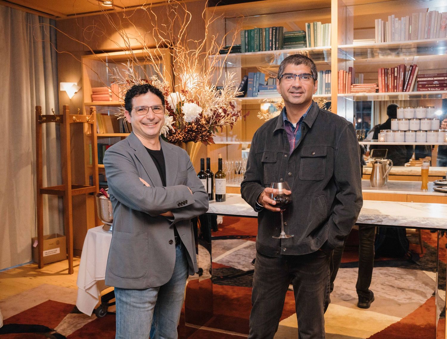 Business professionals gather and network at an upscale restaurant venue during a corporate event.