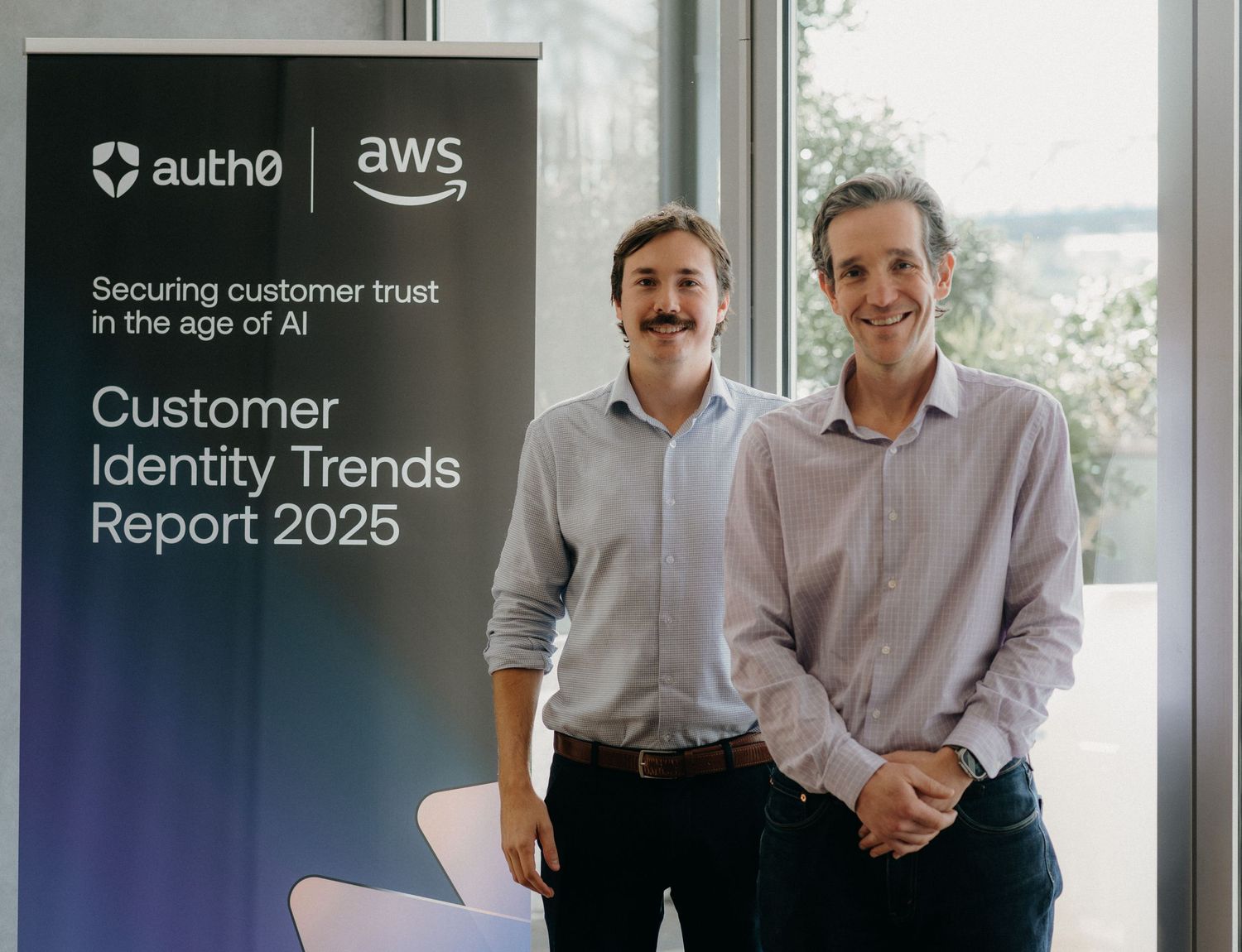 A series of business presentation slides showing Auth0 and AWS branding with customer trust and identity trends topics.