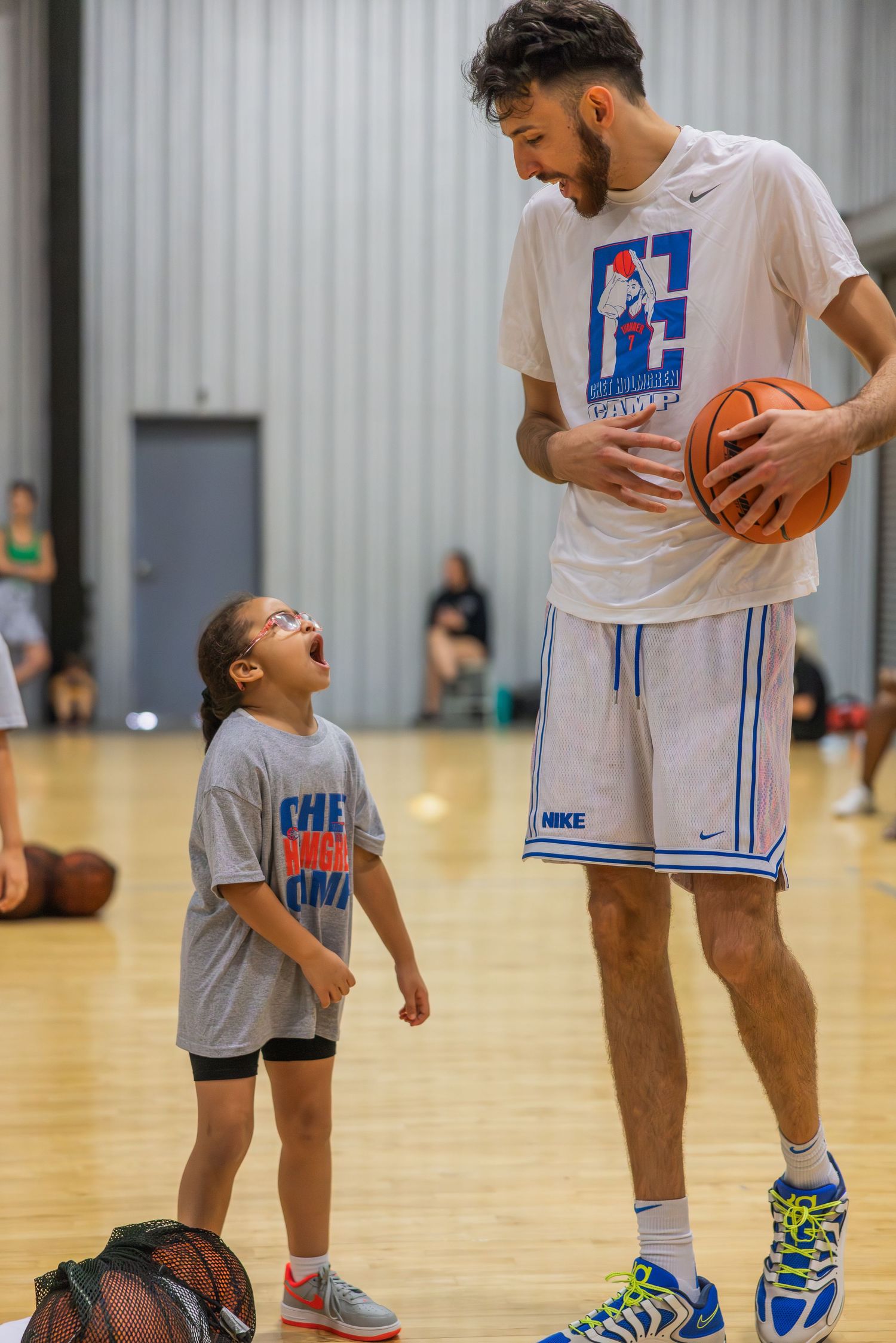 Chet Holmgren chats with a youth camper.