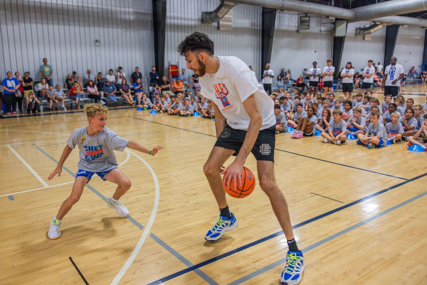 Chet Holmgren challenges a camper to a competition.